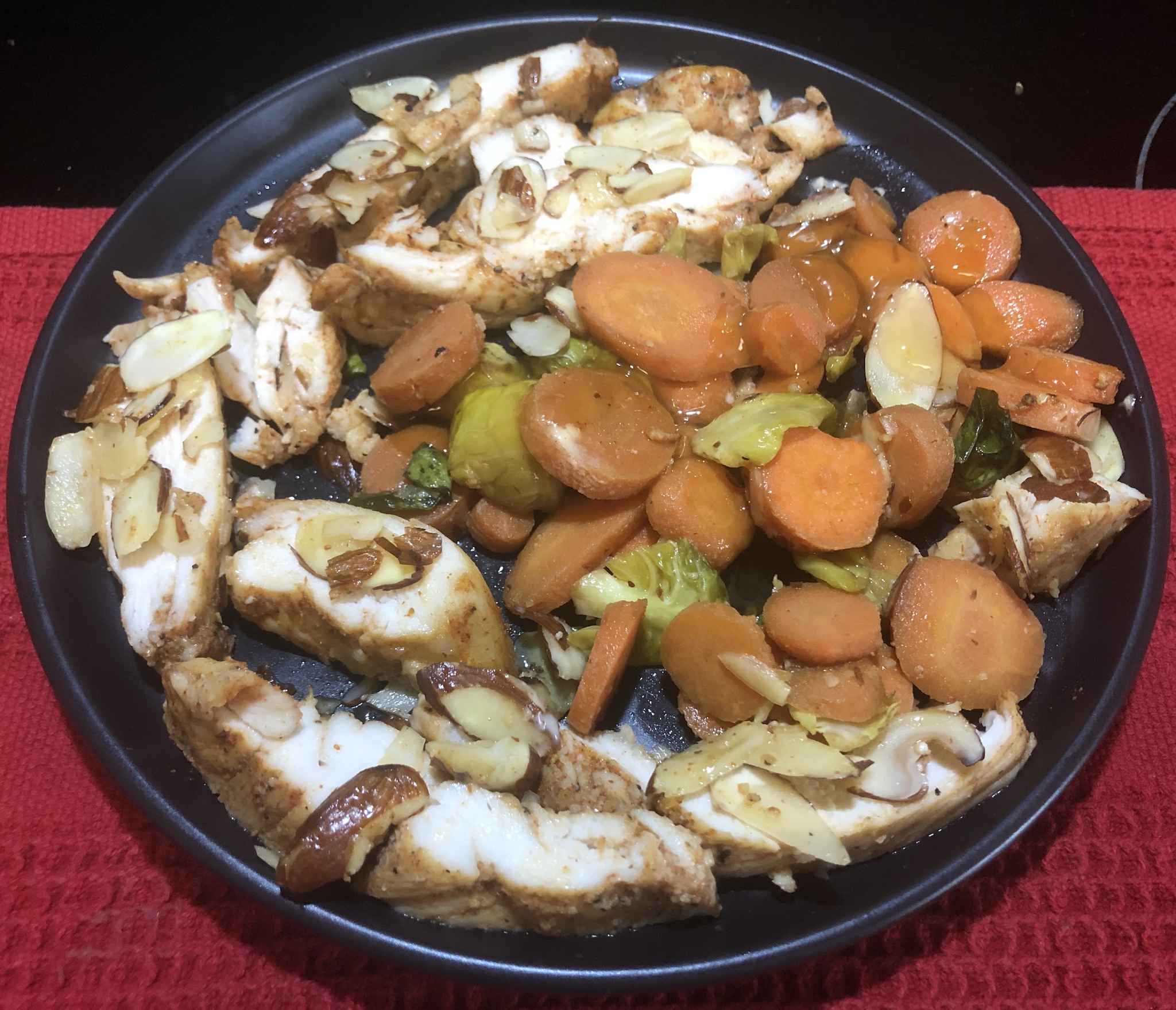 Delicious Crunchy Almond Baked Chicken with Orange-Glazed Brussels Sprouts and Carrots