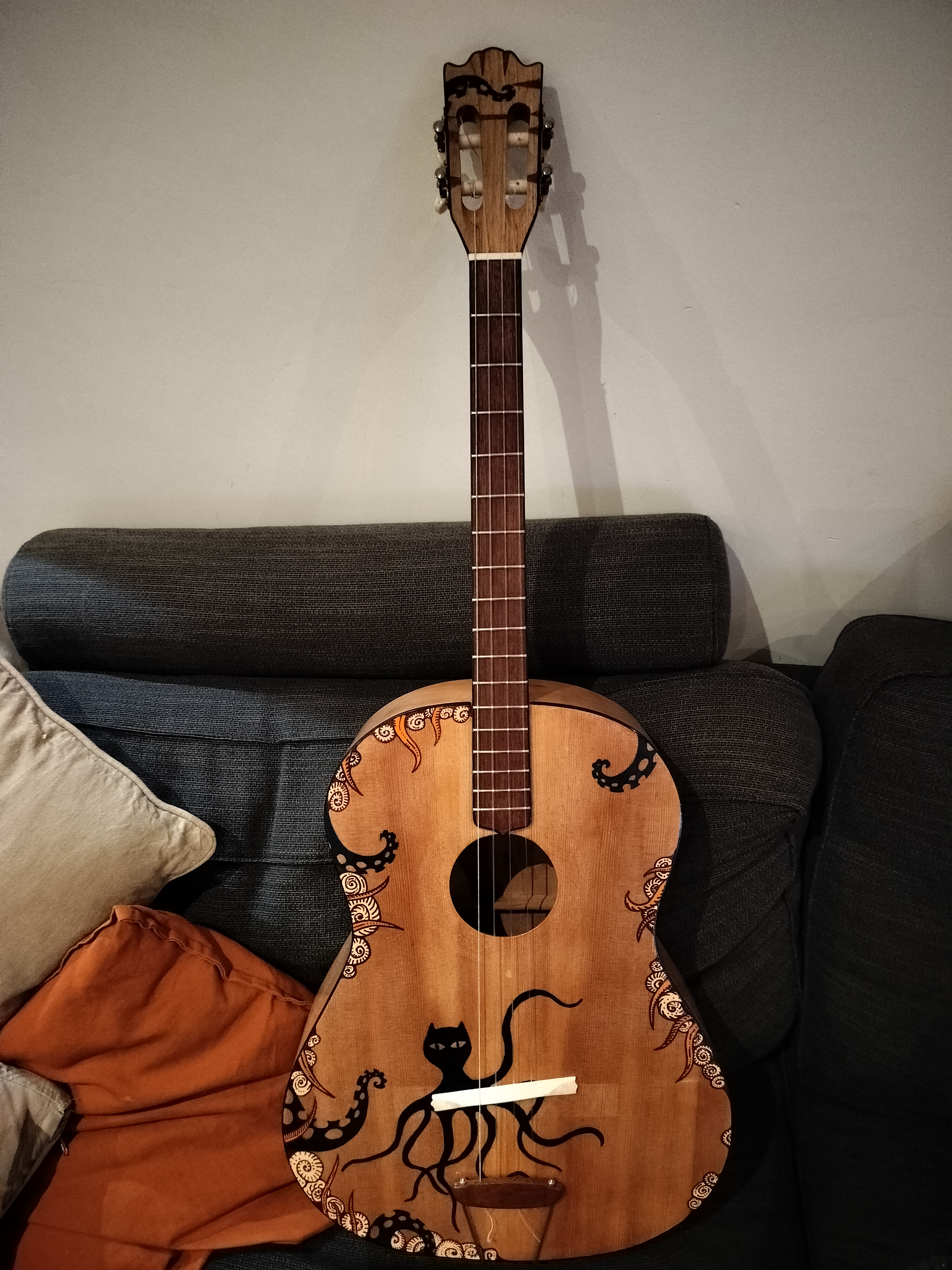 Working on a unique guitar project: tenor guitar meets king-size ukulele.