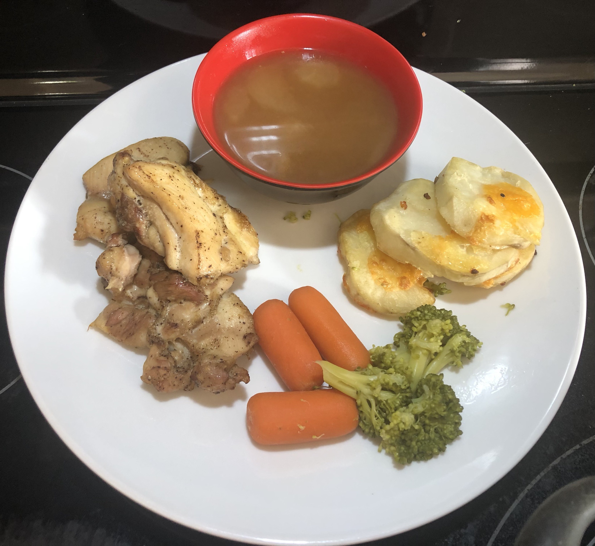 A Delicious Feast: Radish Soup, Baked Chicken, Cottage Fries, and Boiled Veggies