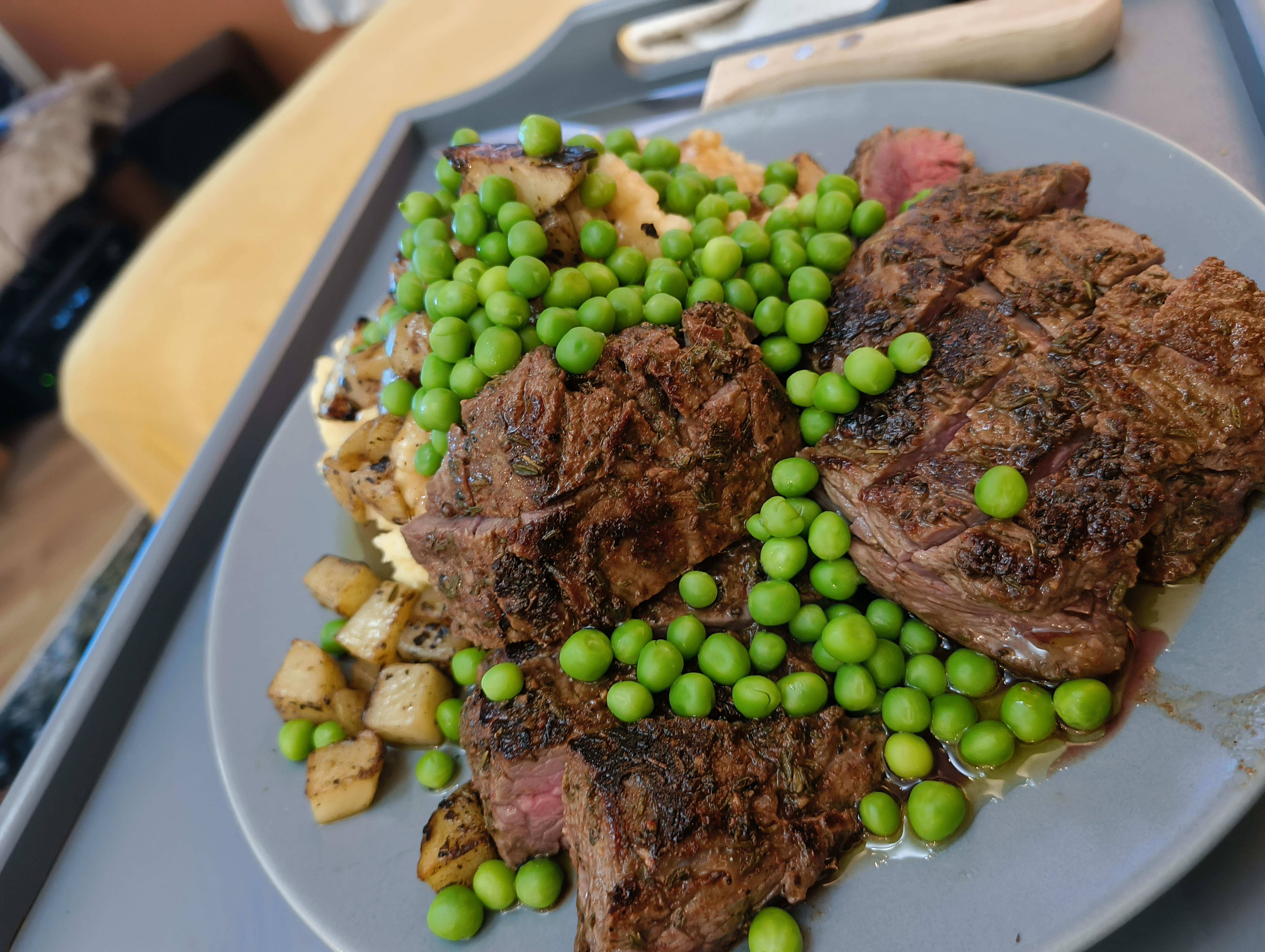 Delicious Flank Steak with Two Styles of Potatoes and Peas - A Feast for the Eyes!