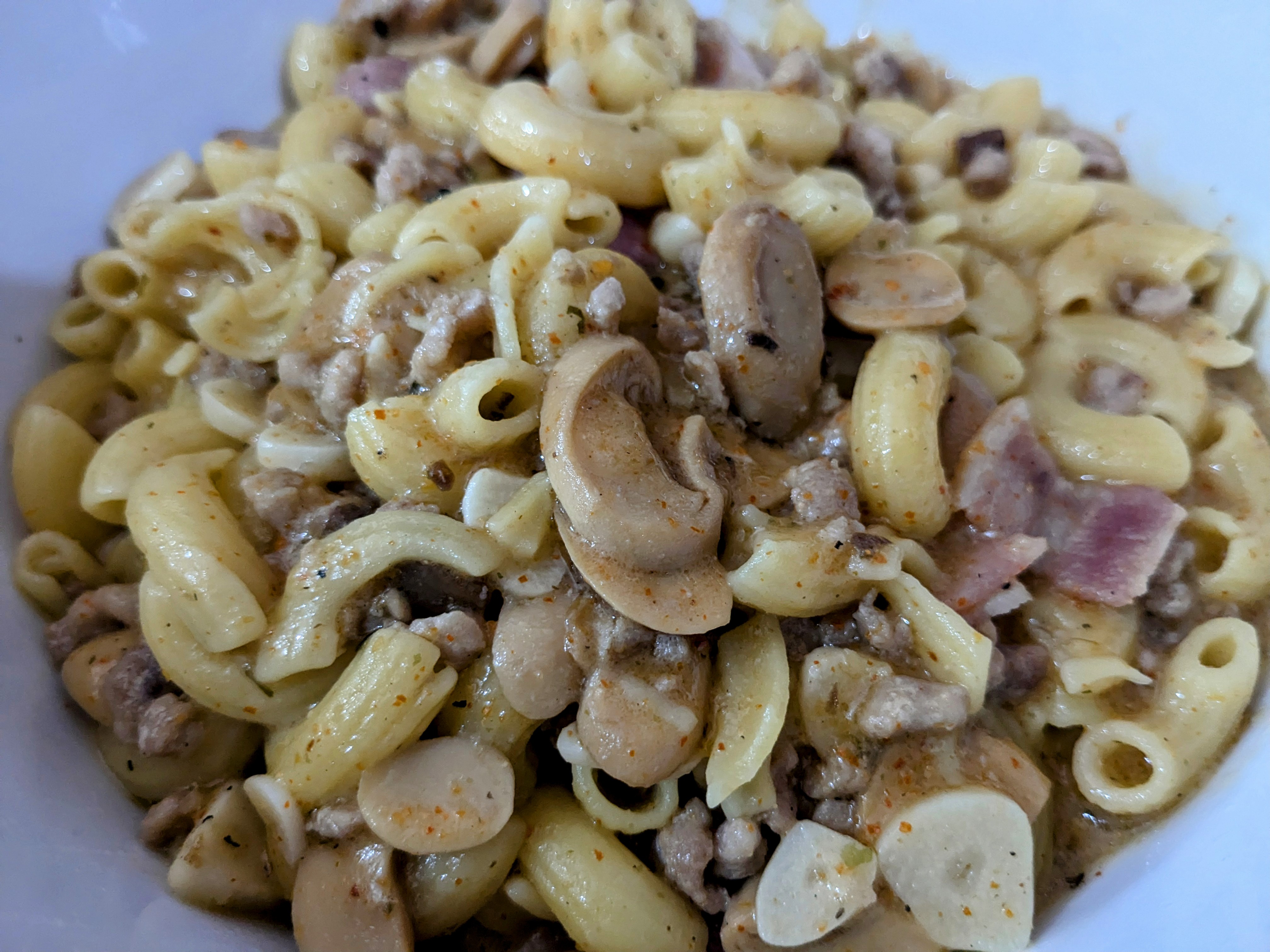Indulge in Mushroom Carbonara Macaroni Loaded with Minced Pork and Smoky Bacon