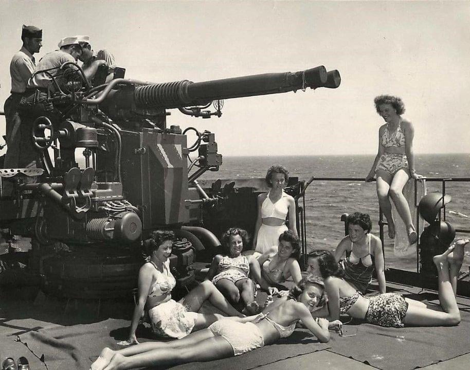 A Glimpse into History: U.S. Army Nurses Relaxing by a Twin Bofors Gun, 1945