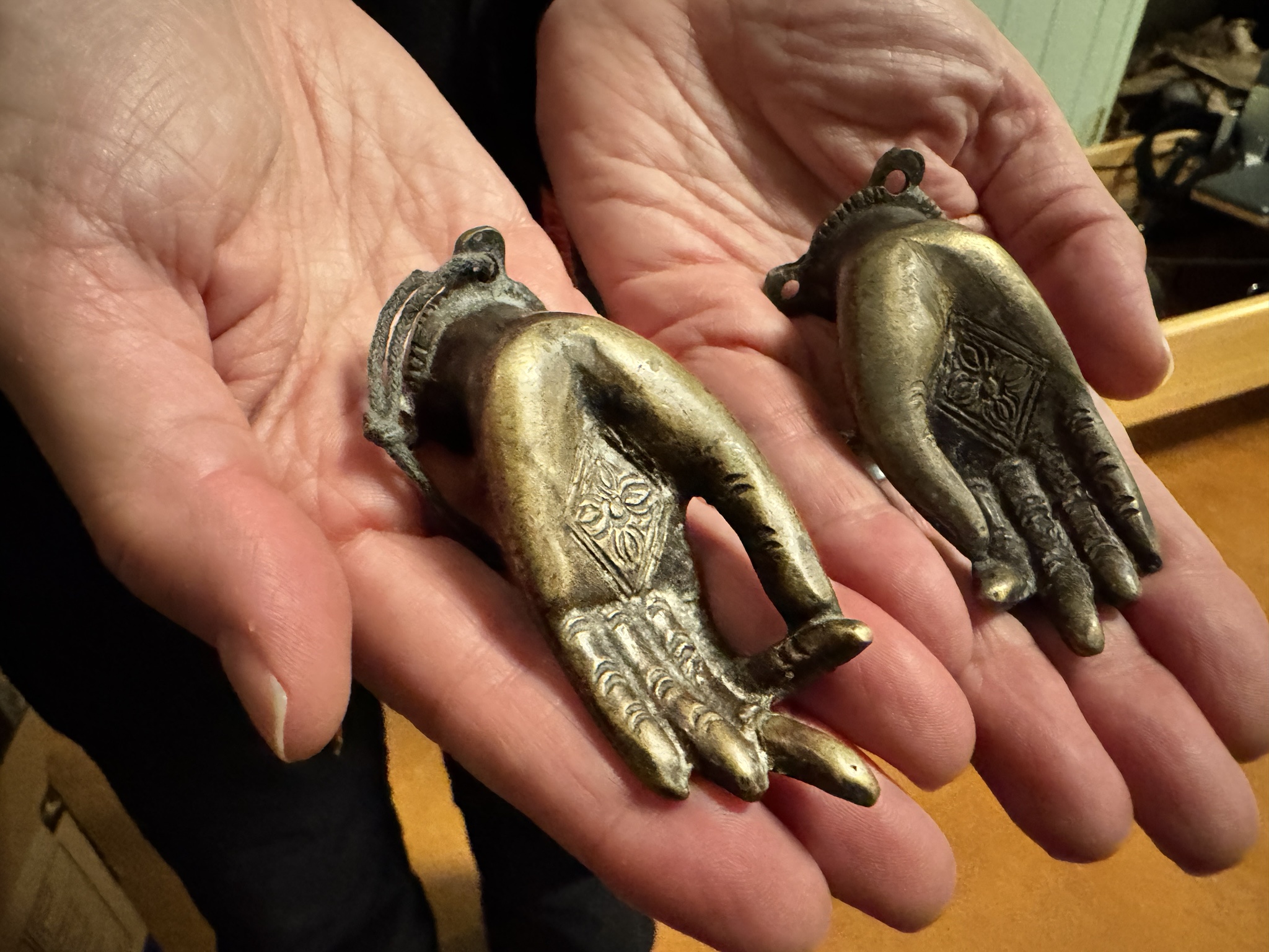 I found these stunning castings in India... how should I display them on the wall? Is it disrespectful to mount them facing upward for coat hooks?