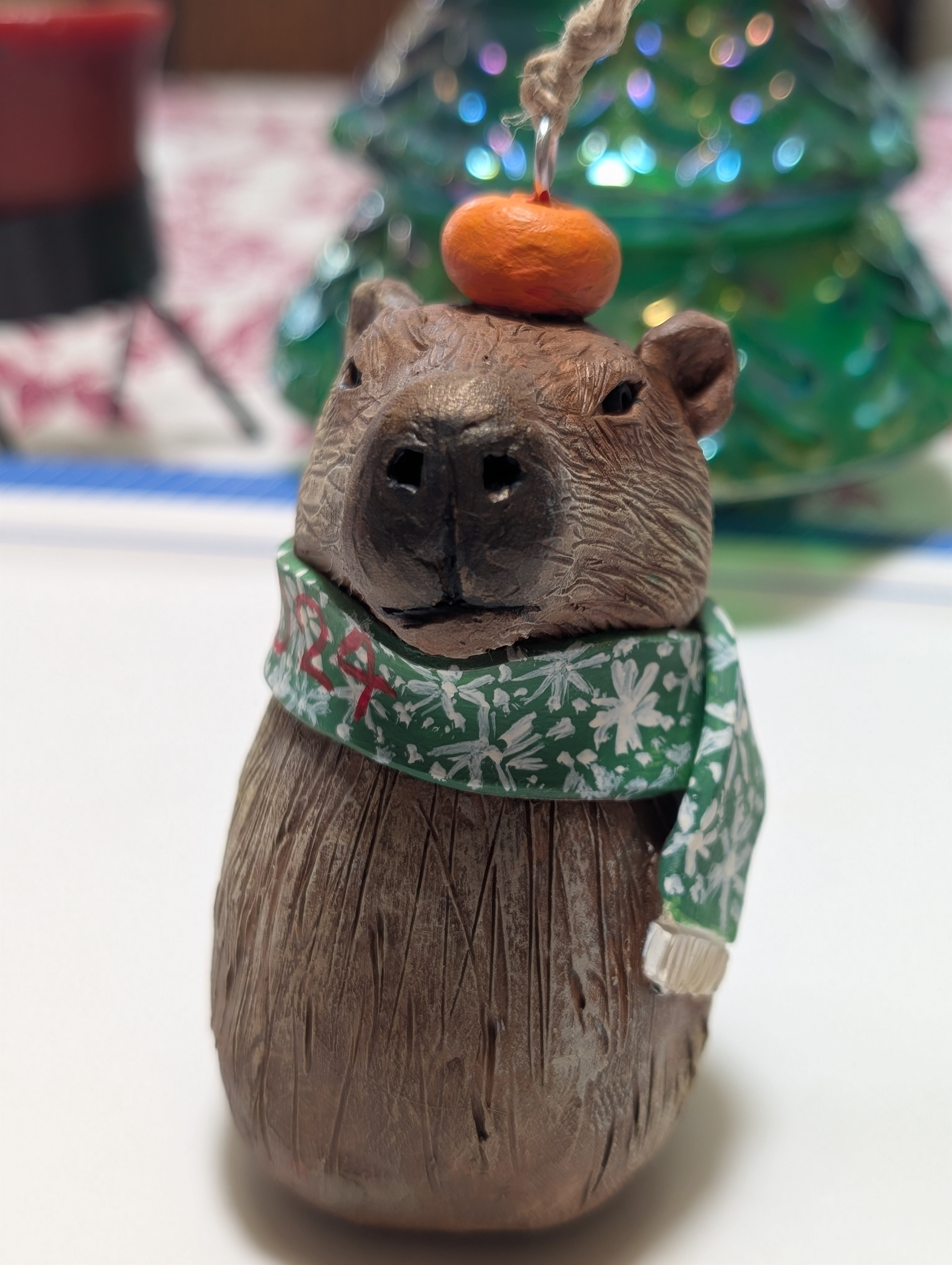 This Year's Holiday Ornament: A Capybara with an Orange Hat