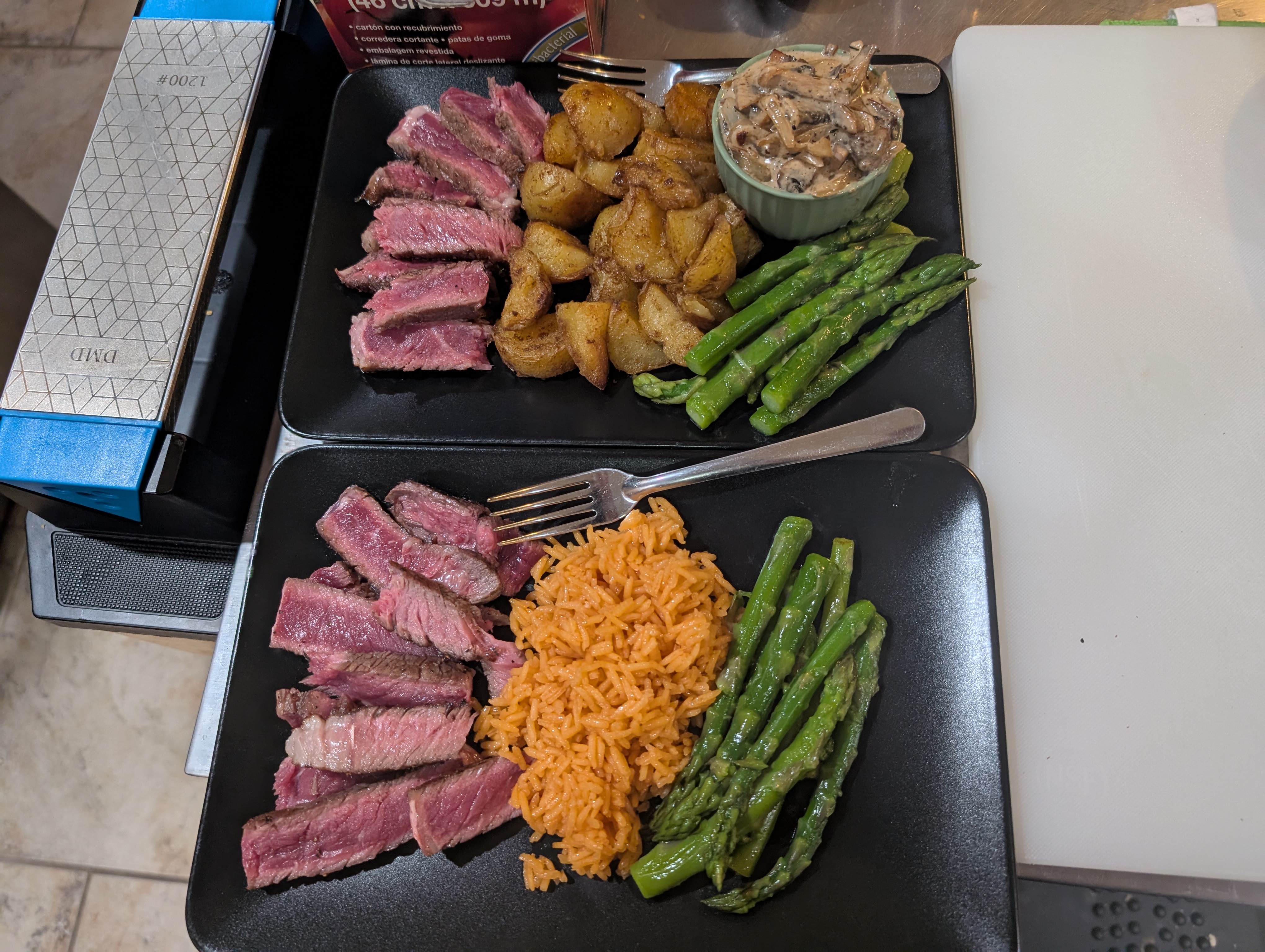 Indulgent butter-basted ribeye with garlic thyme cream sauce, paired with potatoes for him and rice for me!