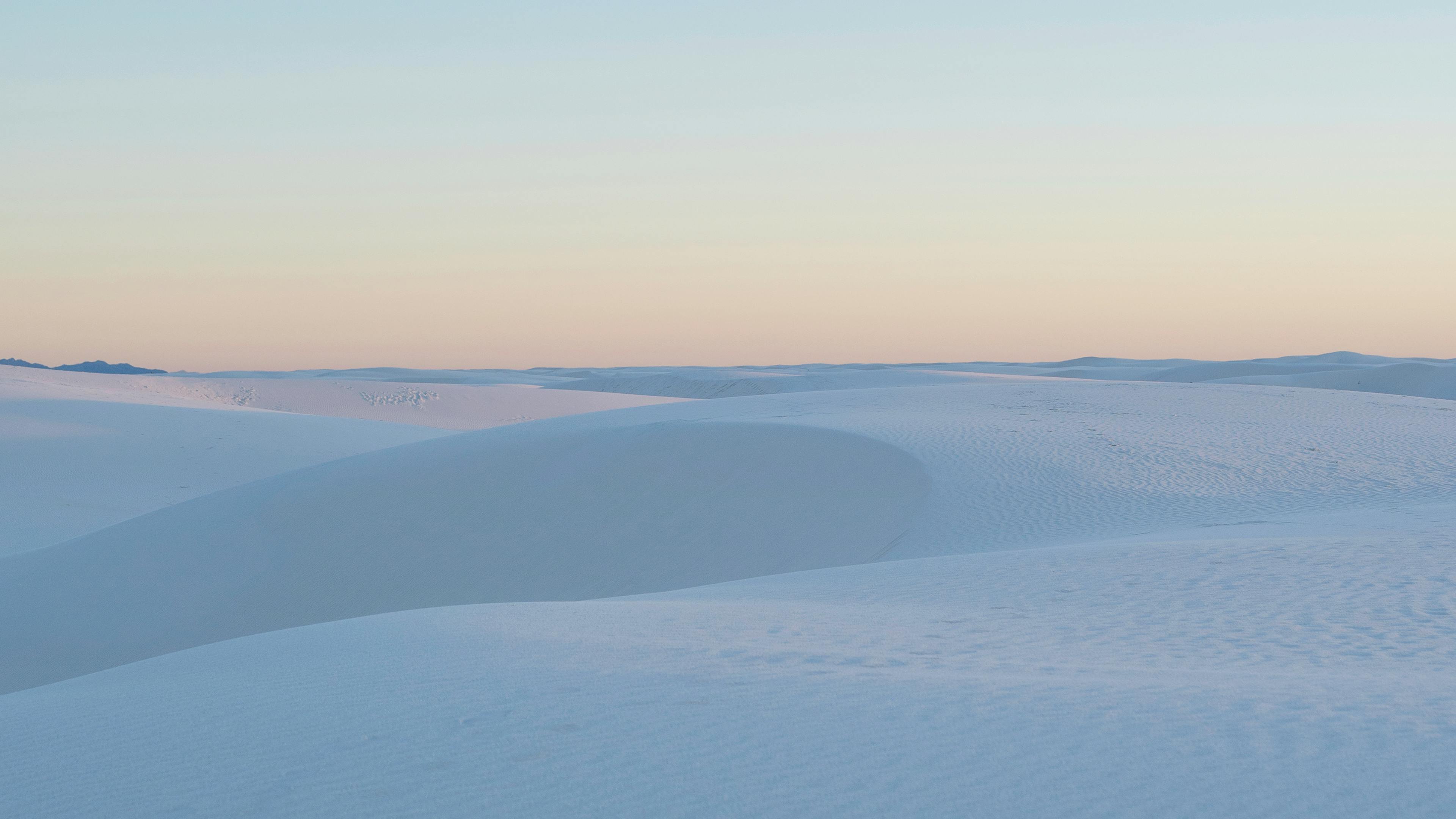 The Gentle Embrace of Dawn Over the Serene Dunes