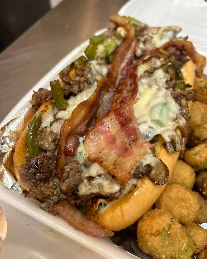 Savoring a Philly Cheese Steak Sub with Crispy Fried Okra