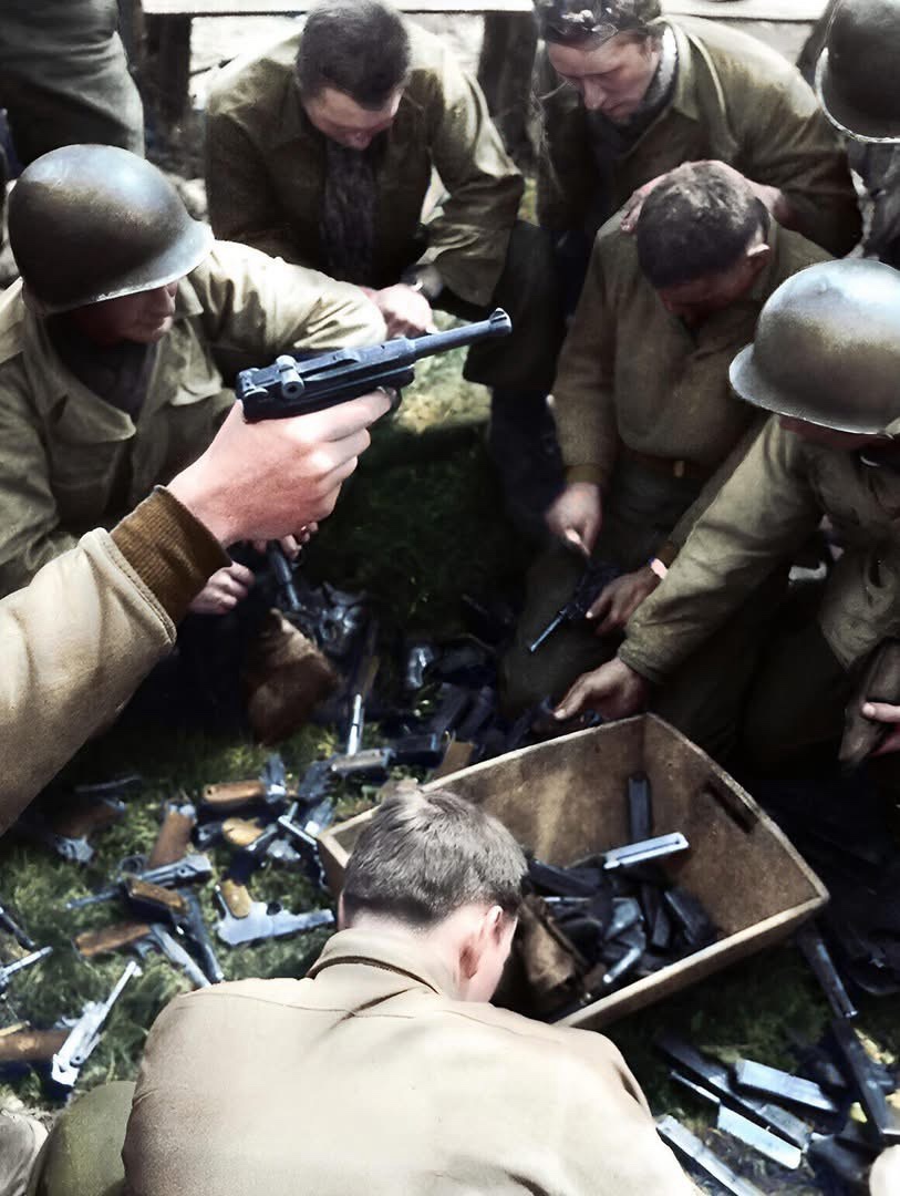American Soldiers Examining Captured German Weapons in Berchtesgaden, April 1945
