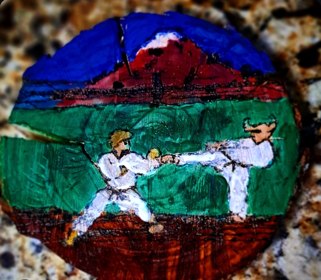 Creating art with KARATEKA on Apple II through woodburning and paint.