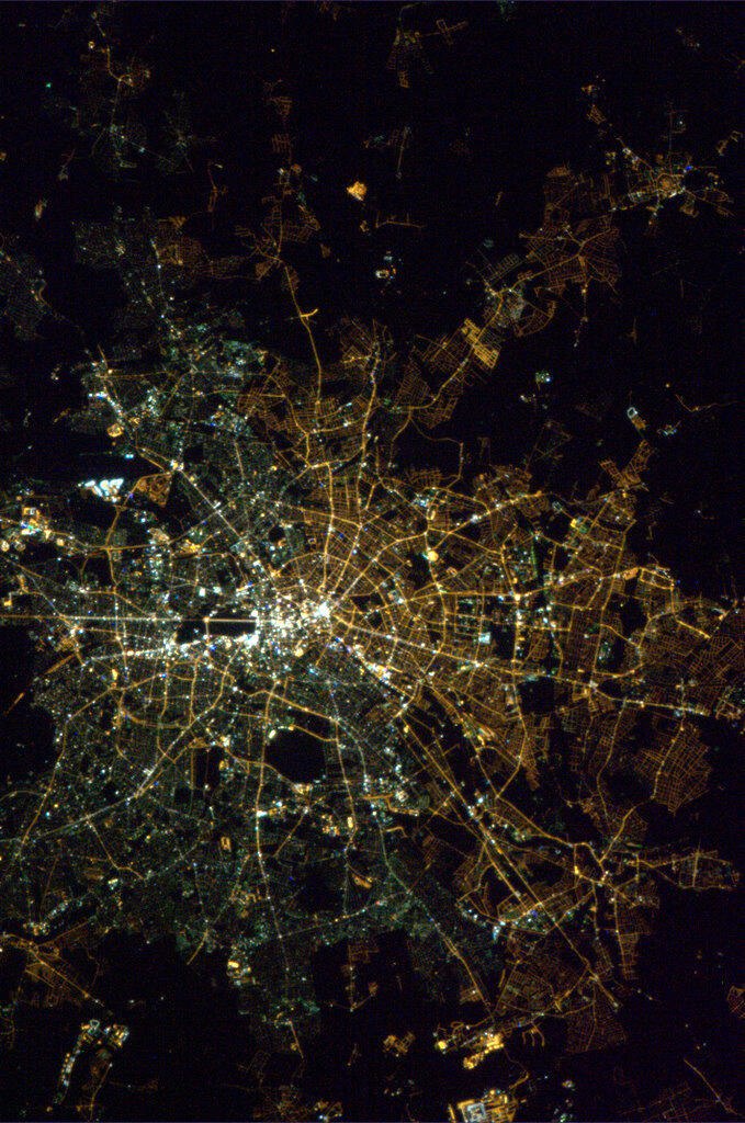 The visible divide of East and West Berlin: a unique perspective from space with contrasting street lights