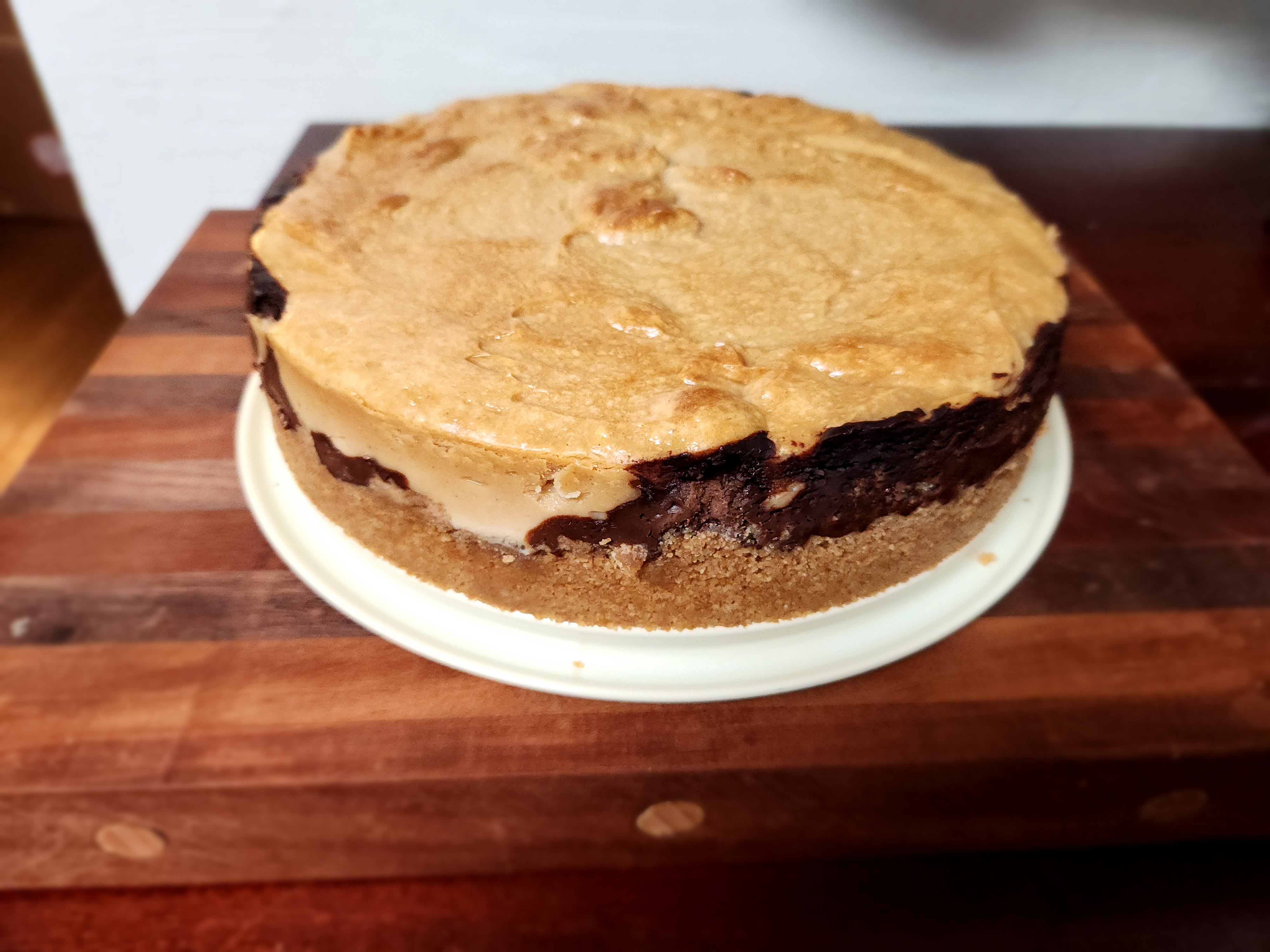 Indulge in This Homemade Peanut Butter Cheesecake with Dark Chocolate Ganache