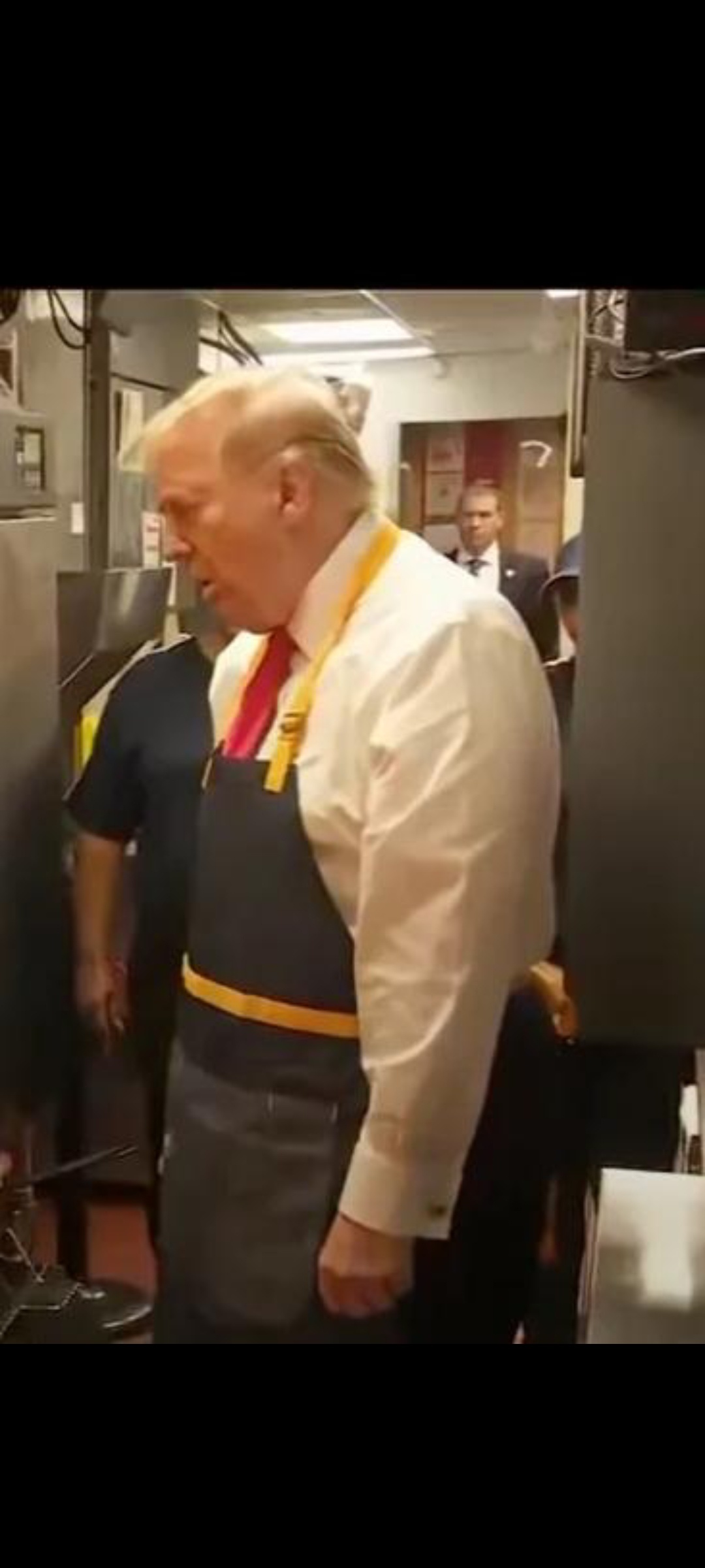 A lazy old worker pretending to be busy.