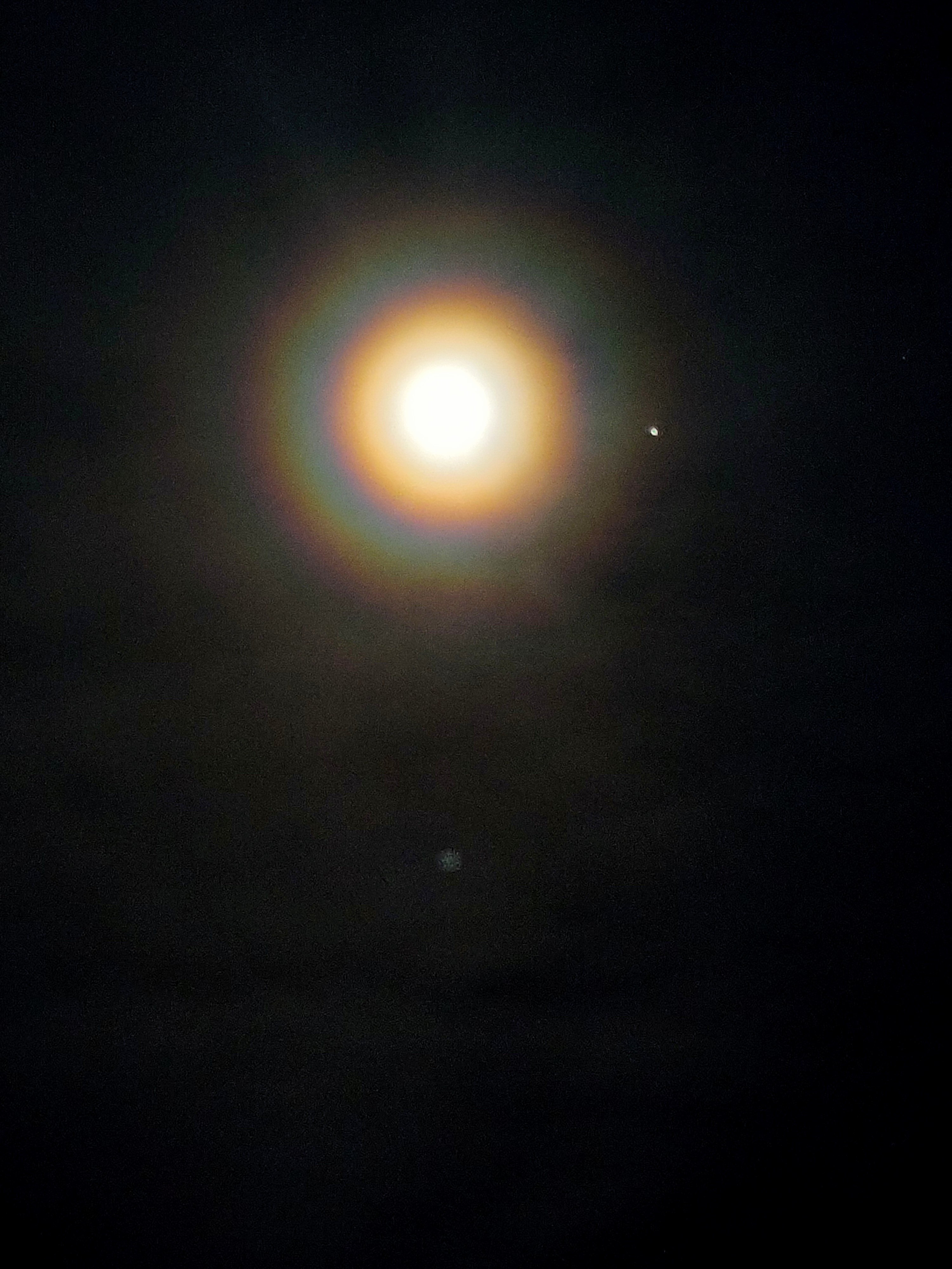 Have You Ever Witnessed a RAINBOW Surrounding the MOON at Night?
