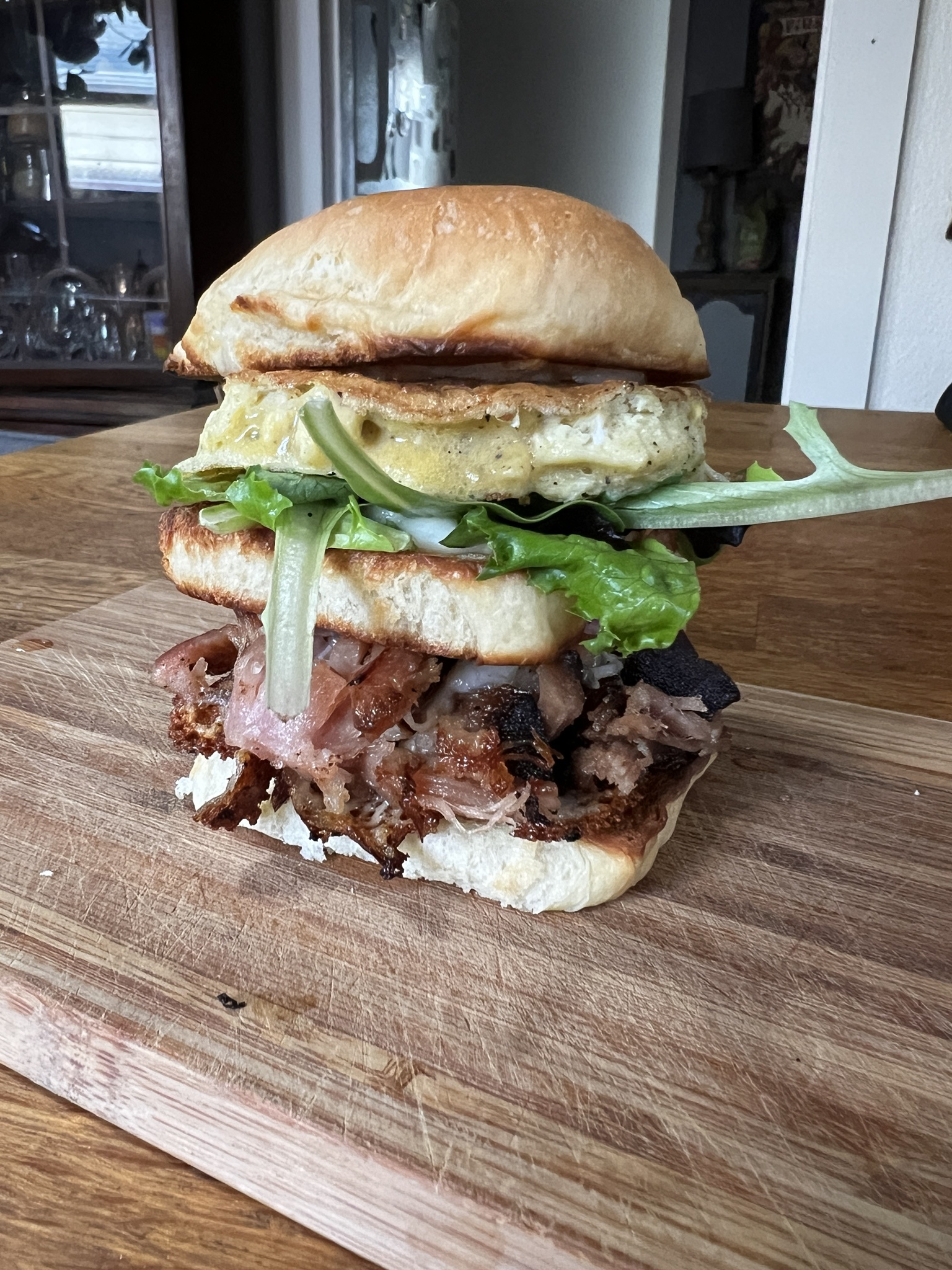 A Delightful Breakfast Sandwich Nestled in a Potato Roll