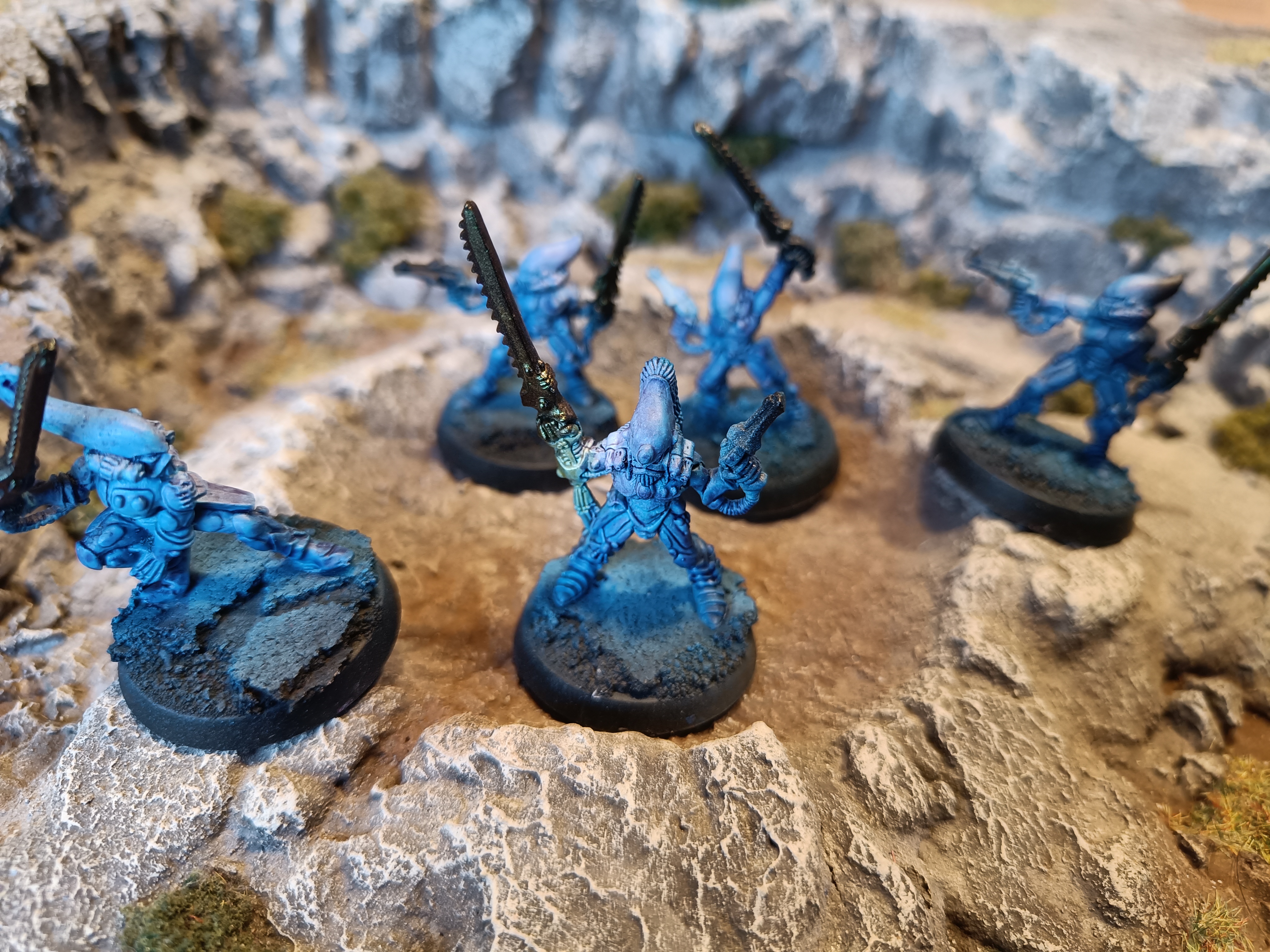 Five Aeldari Striking Scorpions ready for action