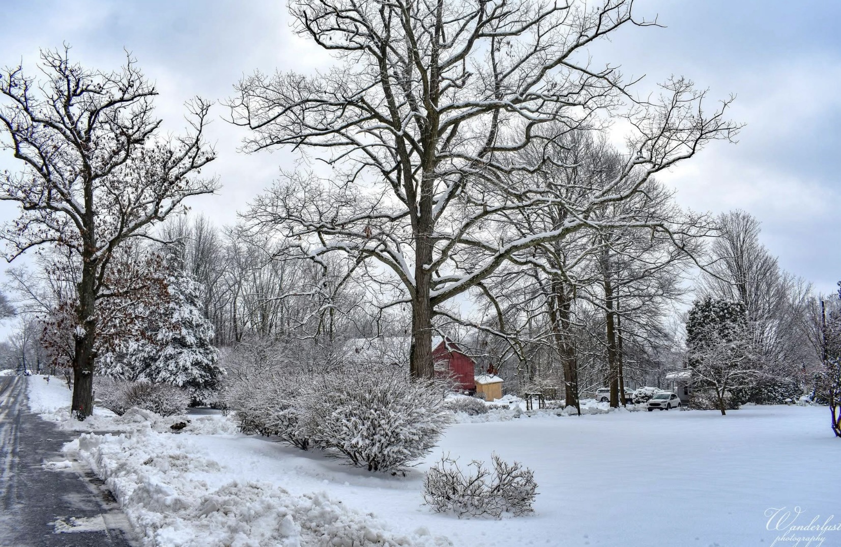 A serene barn blanketed in snow