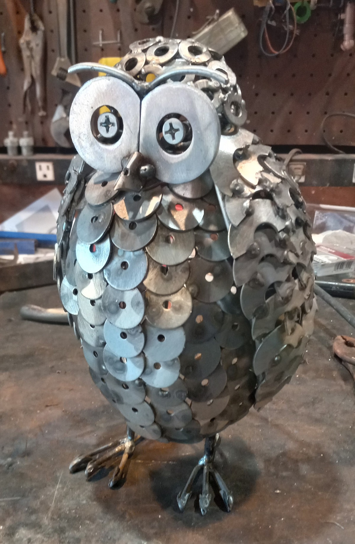 A stunning metal owl sculpture that captures the imagination