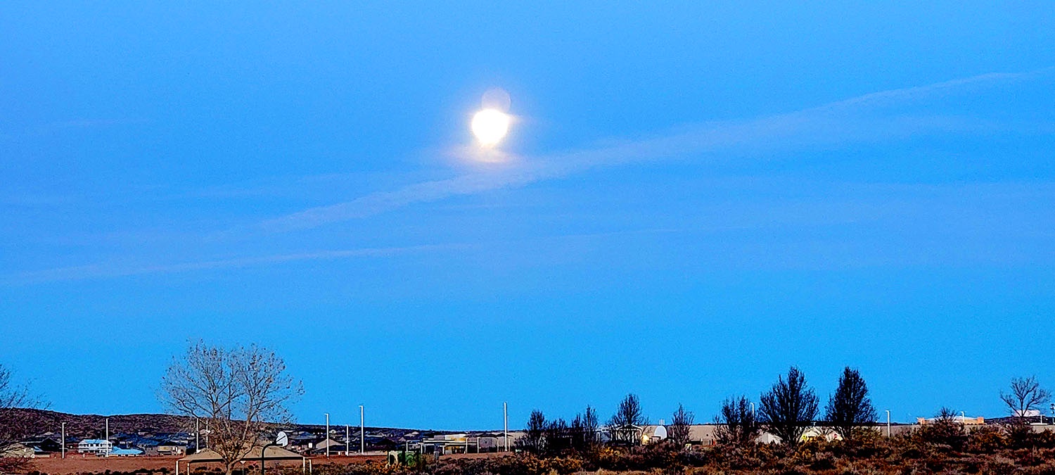 Capturing the Beauty of Moonset on a Sunday Morning