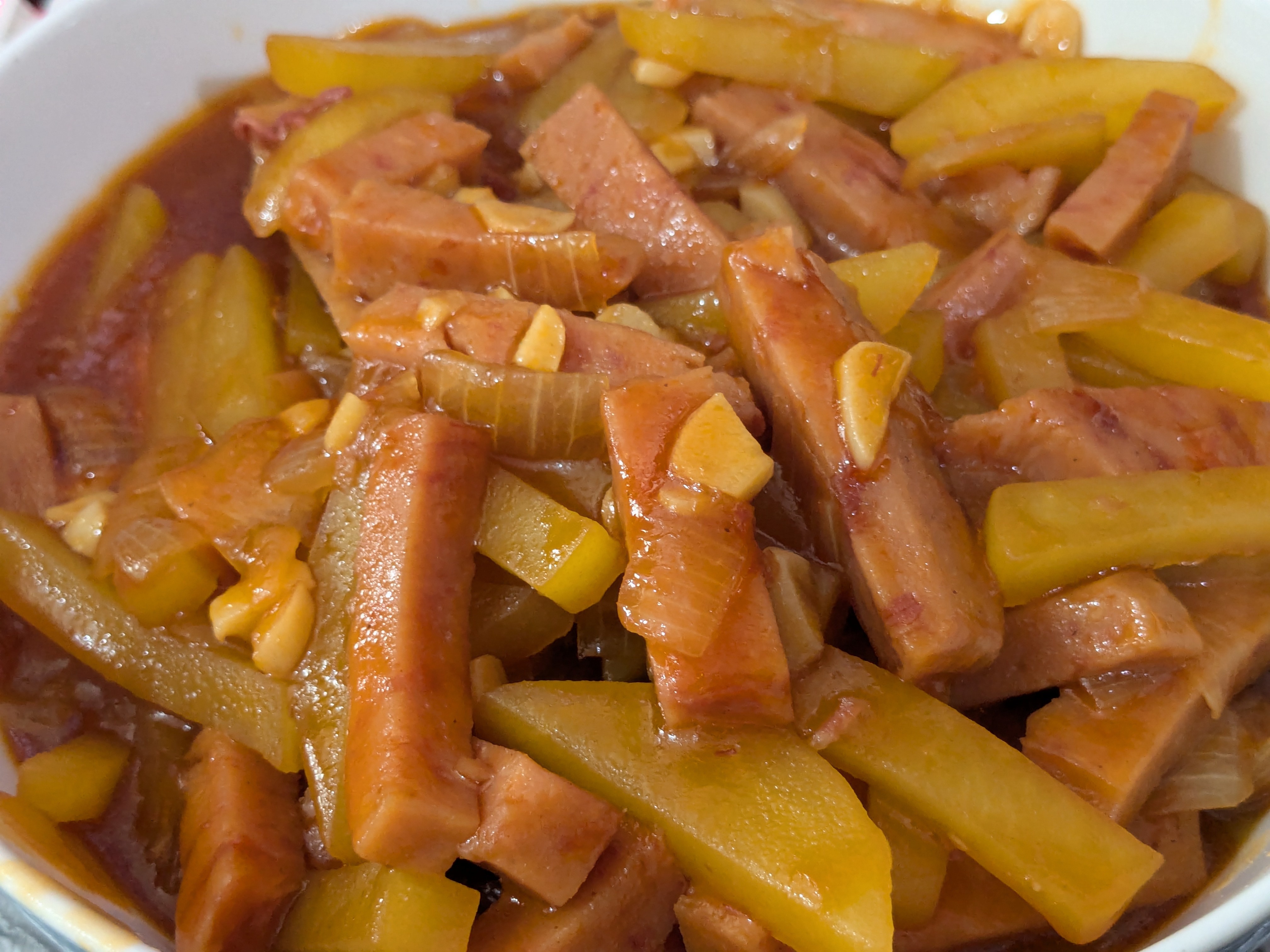 Delicious Duo: Sweet and Sour Luncheon Meat with Potatoes and Stir-Fried Baby Cabbage