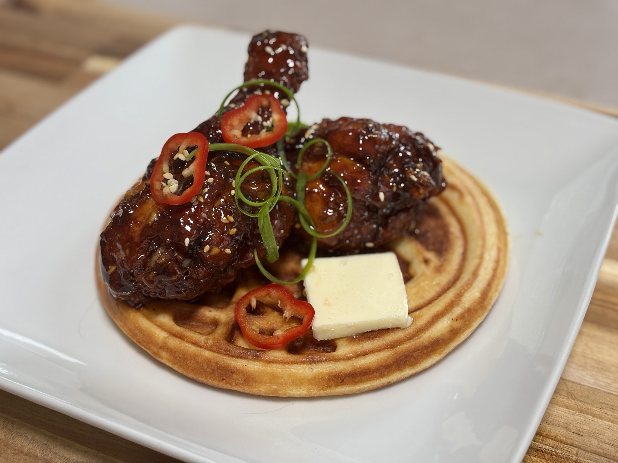 Indulging in Korean Fried Chicken and Waffles - a delicious combo!