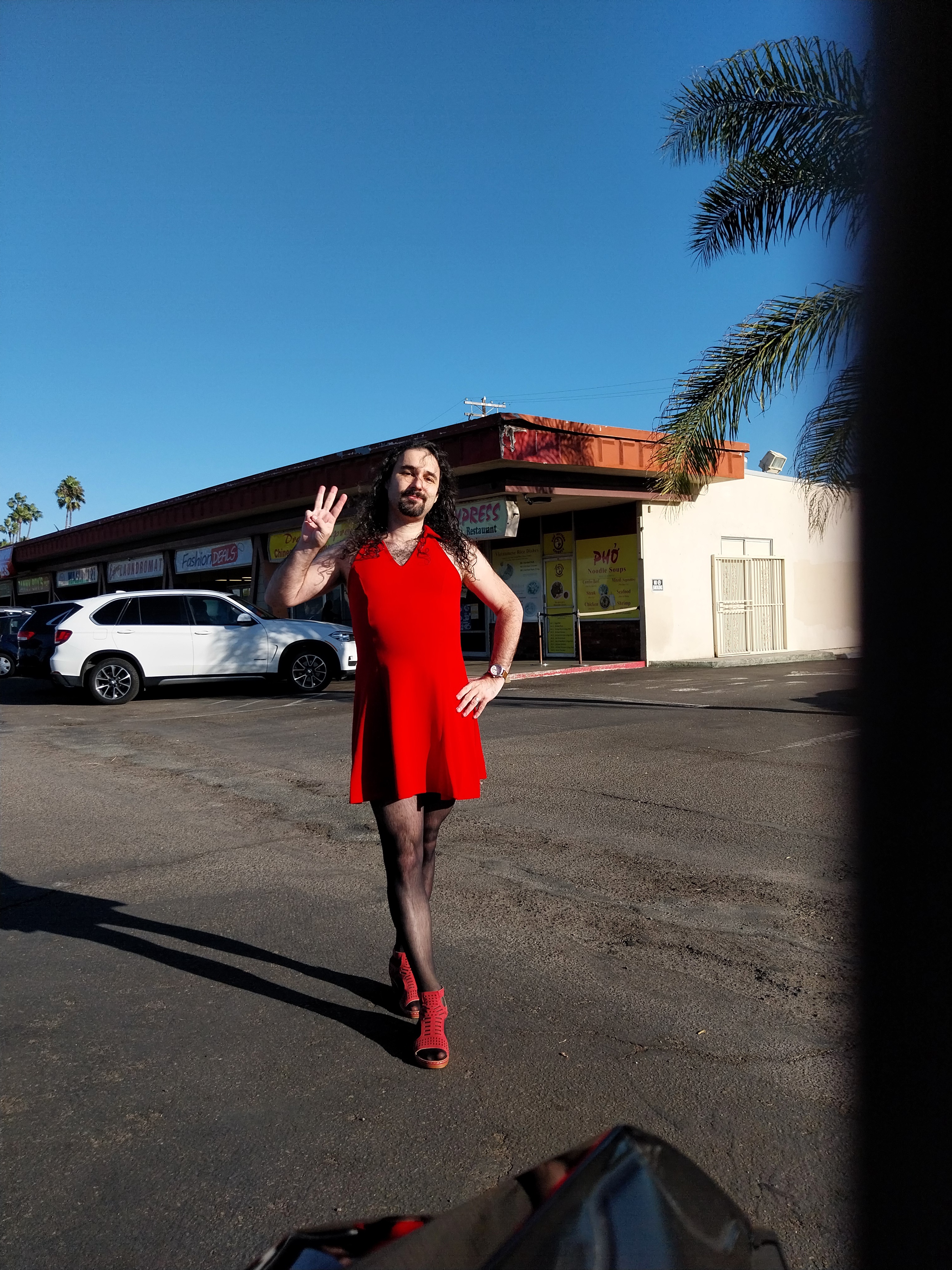 A Nonbinary Individual Rocking a Short Red Dress in San Diego