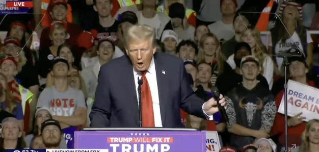 Seriously, why is Trump doing that with the mic?