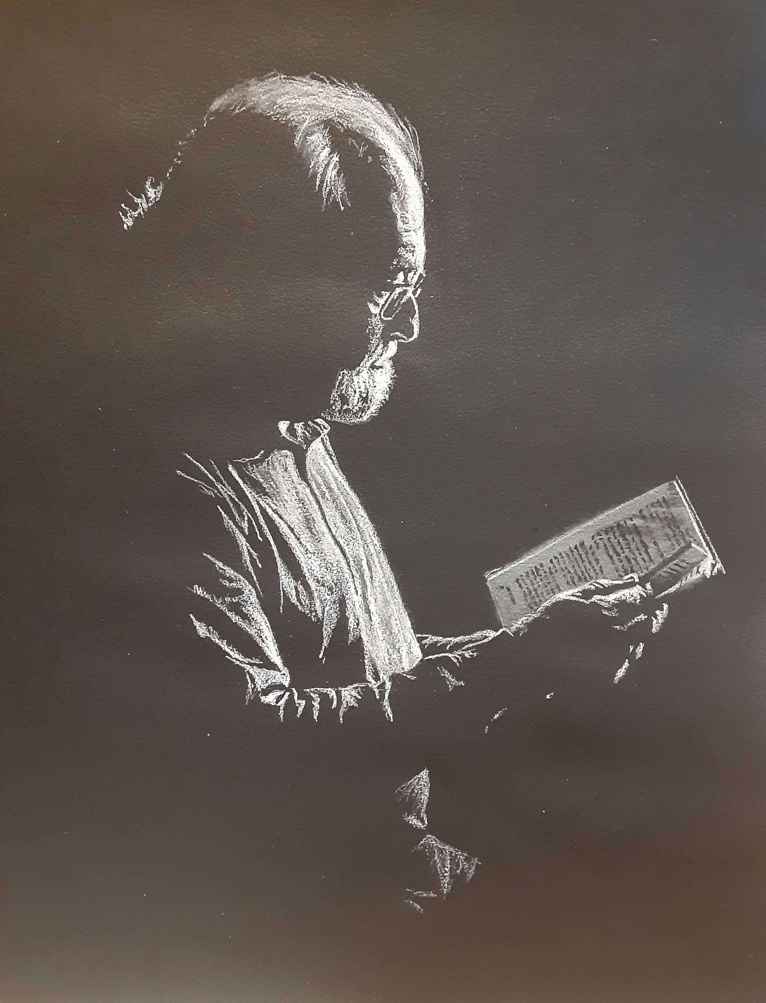 A Whimsical Cake Depicting a Man Reading