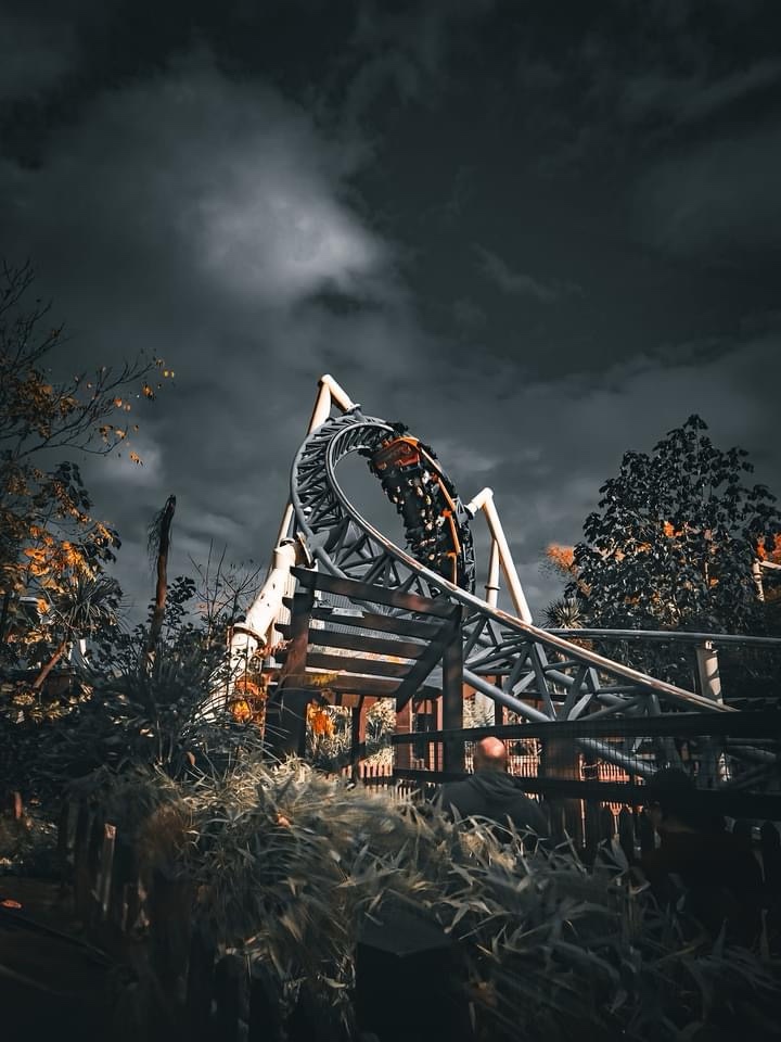 The thrilling ride of a roller coaster.