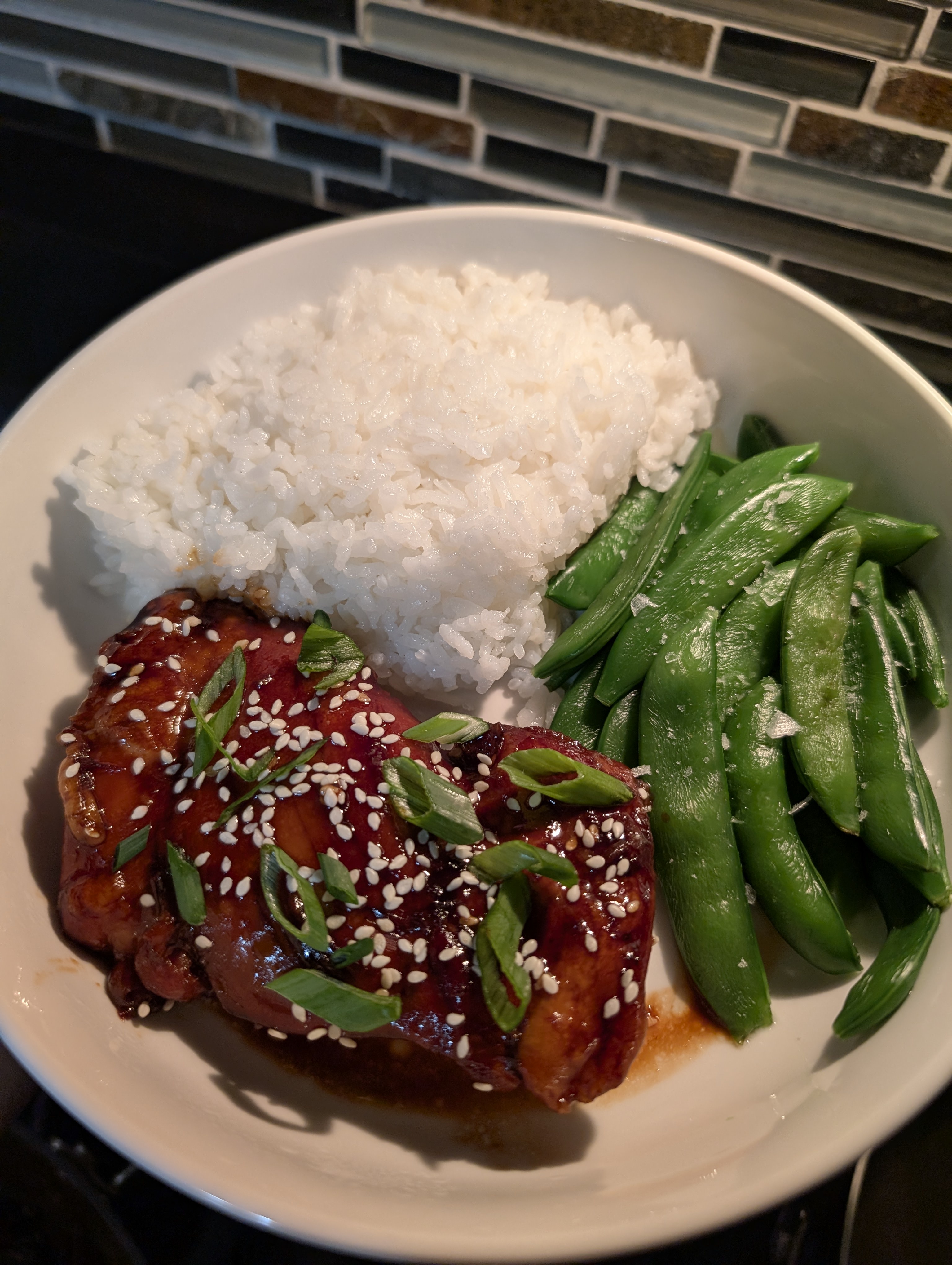 Delicious chicken teriyaki paired with fresh sugar snap peas.