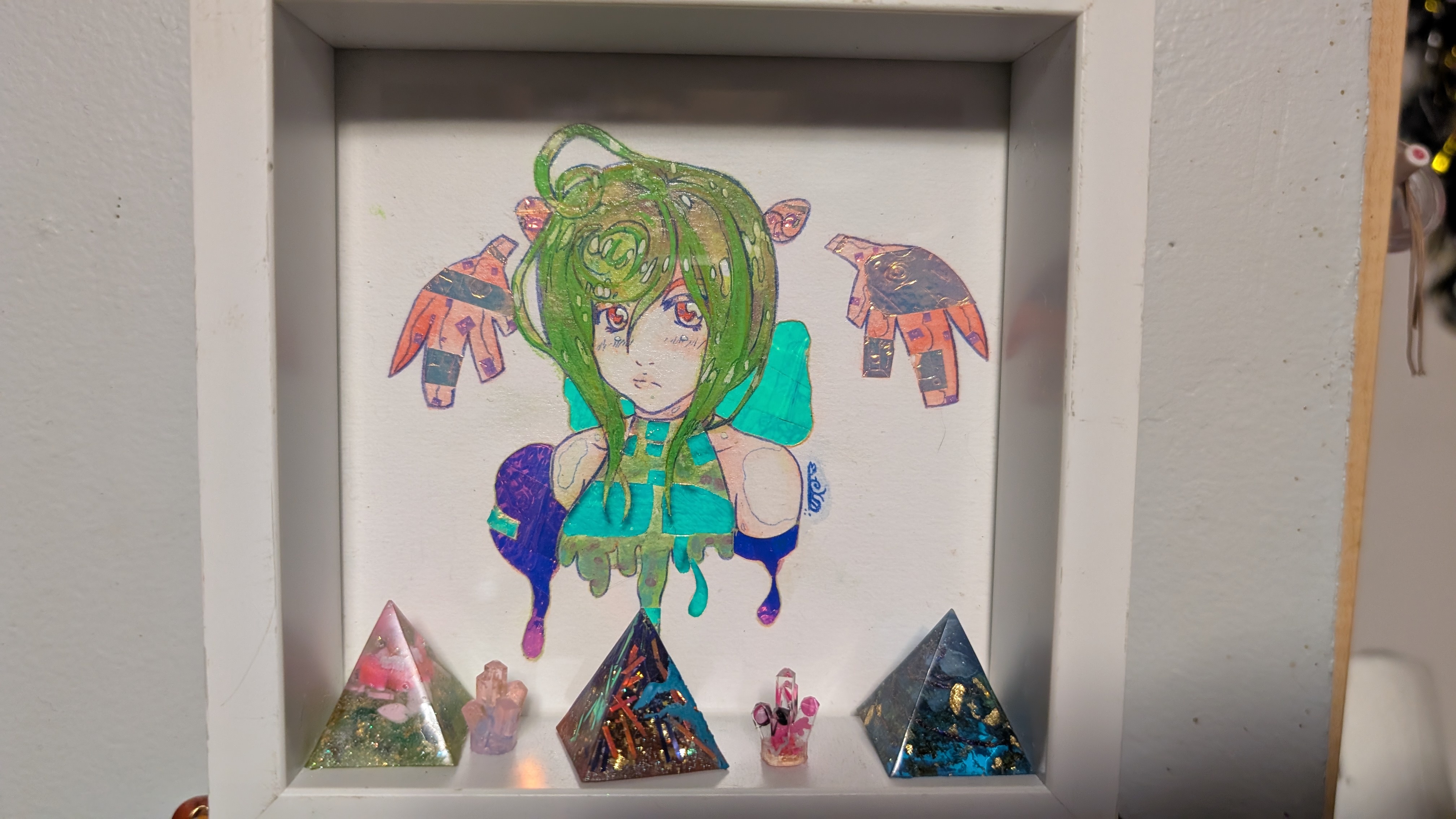 Check out this random art I created! I did all the drawings and resin pieces, while the metal items and stickers were sourced elsewhere.