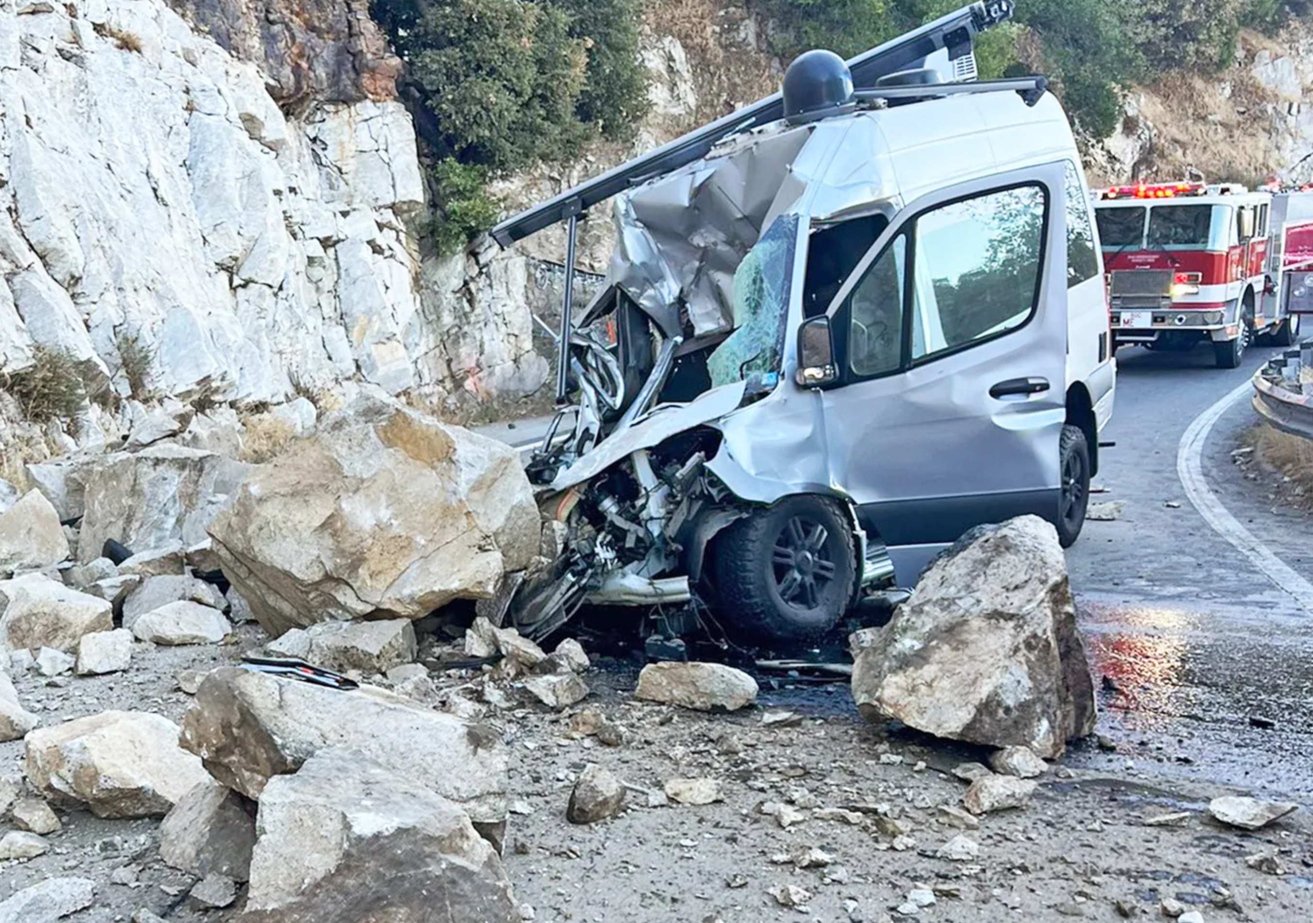A Small Boulder, the Size of a Large Boulder, Obliterates a Van