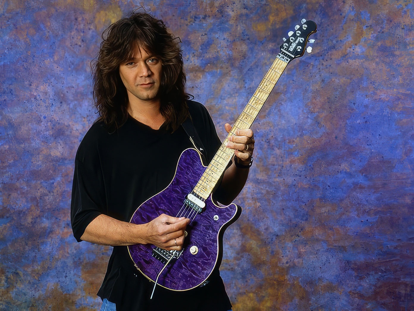 Check out Edward Van Halen rocking his Signature Ernie Ball Music Man Guitar from 1991!