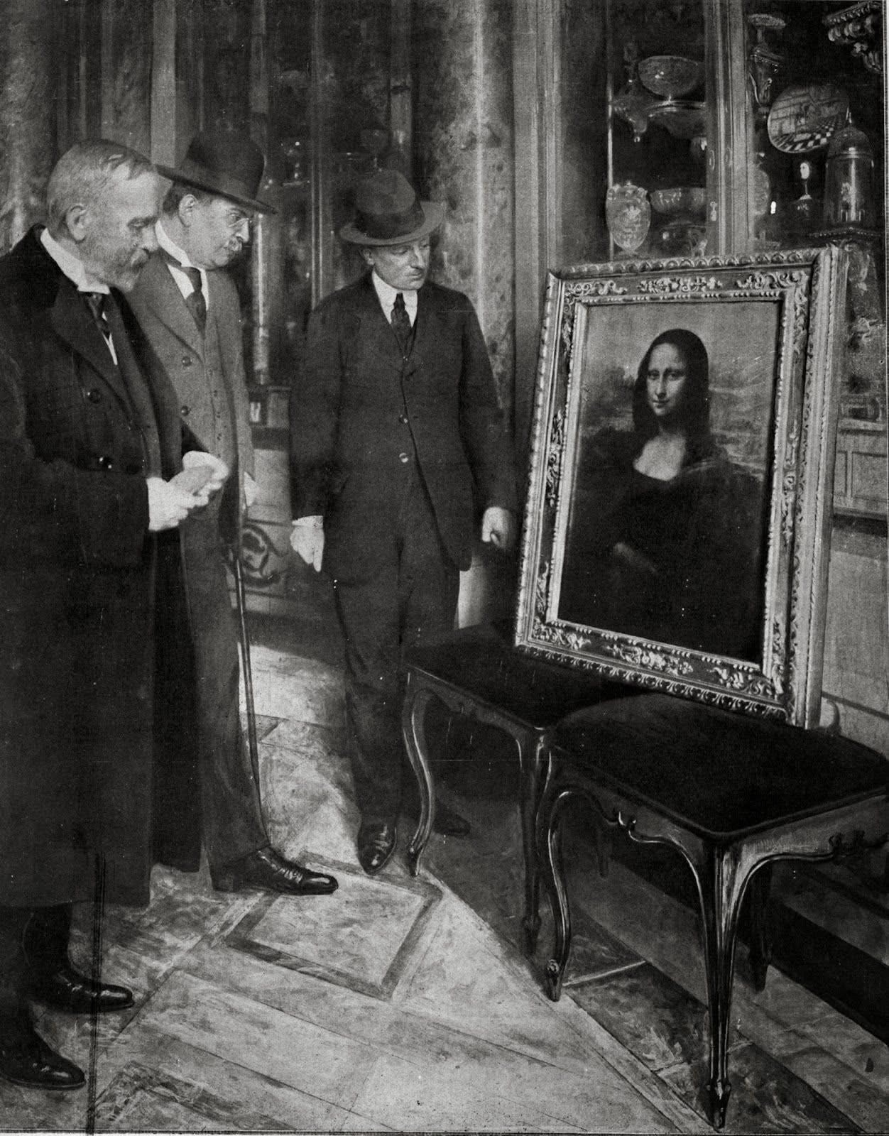 In December 1913, the Mona Lisa made its debut at the Uffizi Gallery in Florence, where museum director Giovanni Poggi was captured examining the iconic painting, which had been stolen from the Louvre in 1911.