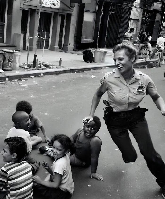 A Nostalgic Moment: NYPD Officer Playing Duck Duck Goose with Kids in 1970