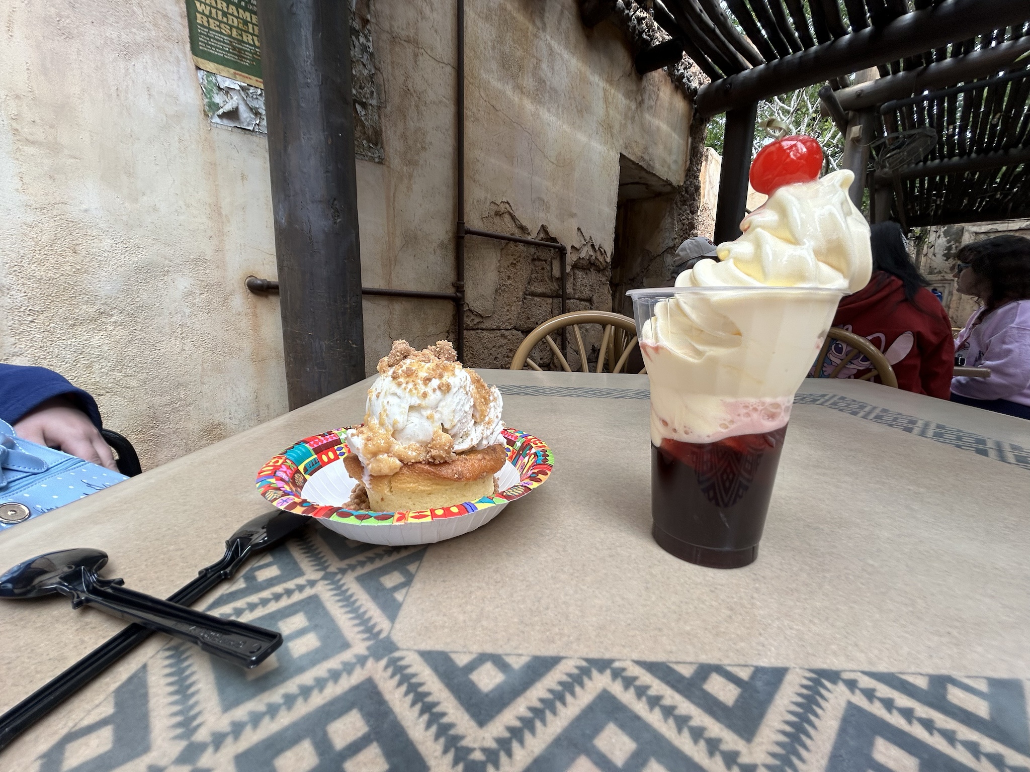 Indulging in a refreshing Sangria Dole Whip paired with a delightful pineapple sundae.