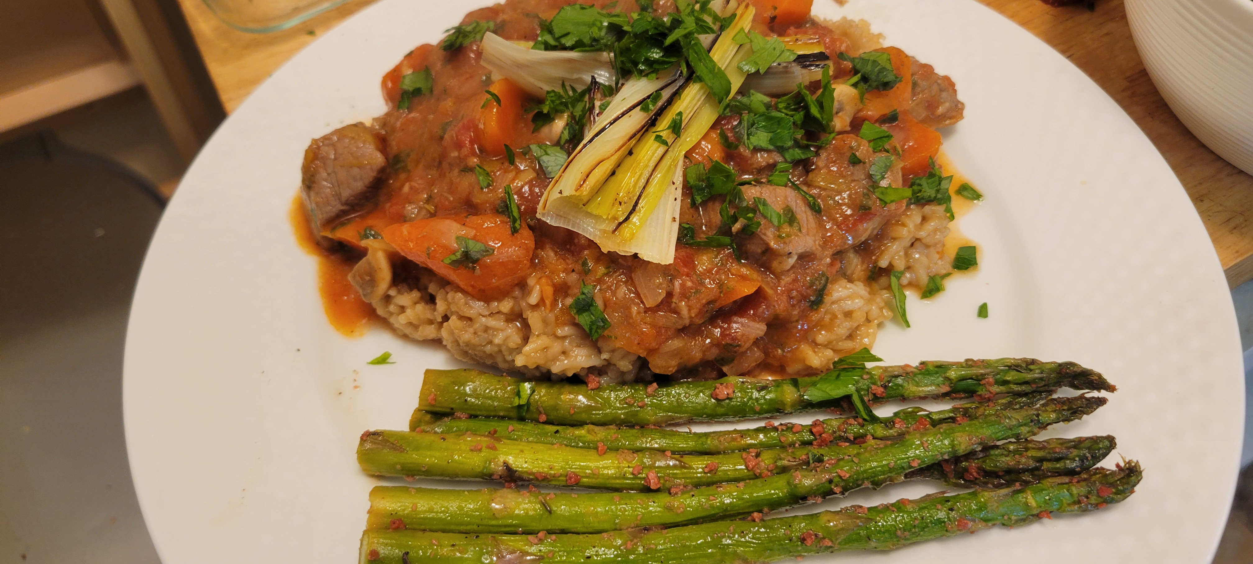 Indulge in Grain-Fed Veal Stew with Bacon-Crusted Lemon Asparagus