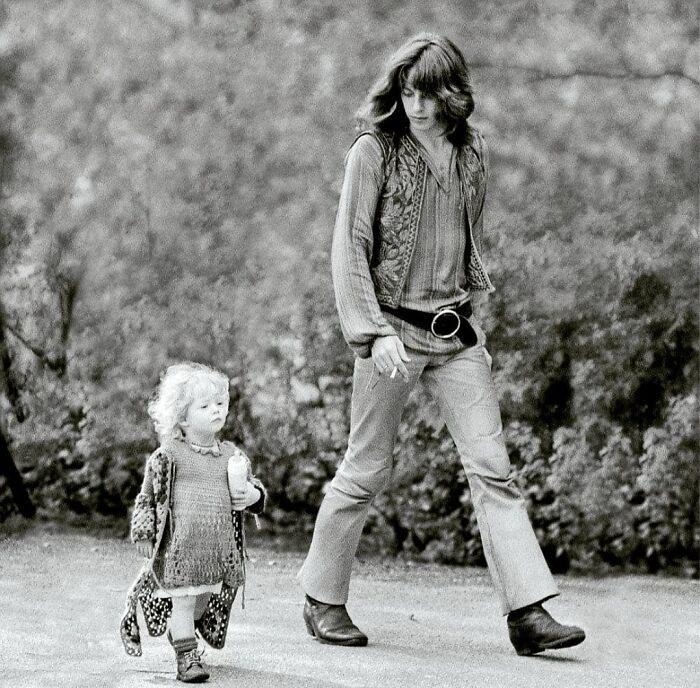 A Groovy Moment: Hippie Dad and Daughter Stroll in 1968 Amsterdam