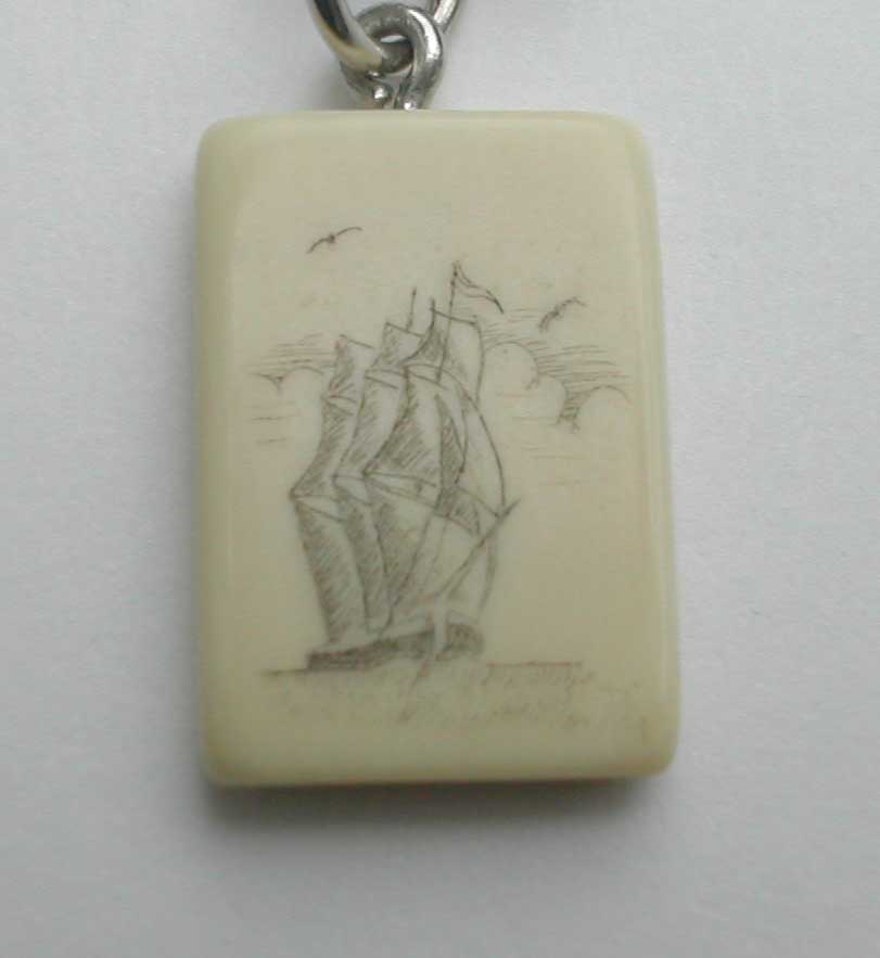 Intricate Scrimshaw Art of a Ship on Fossilized Ivory