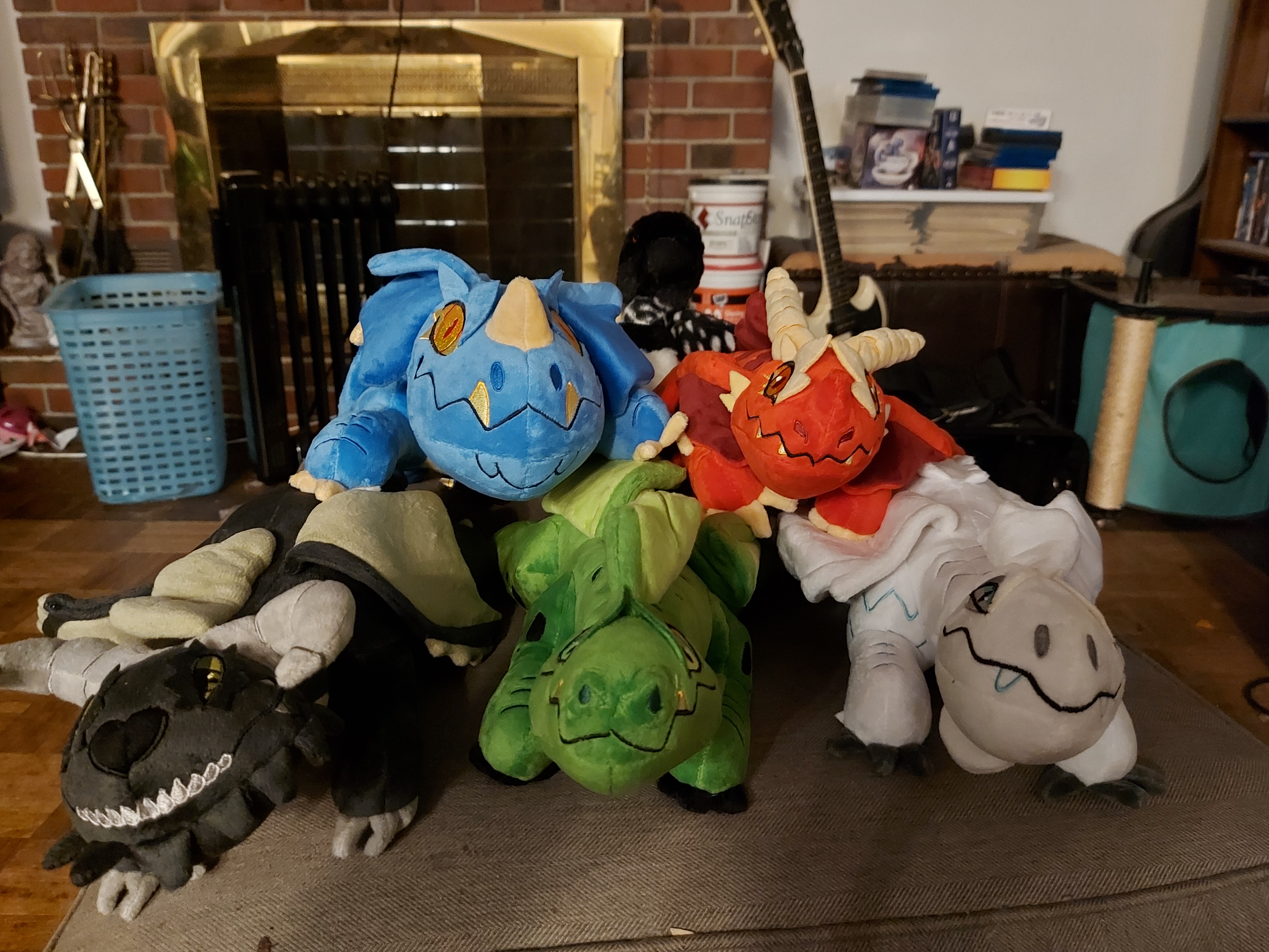 A Cozy Pile of Dragon Plushies