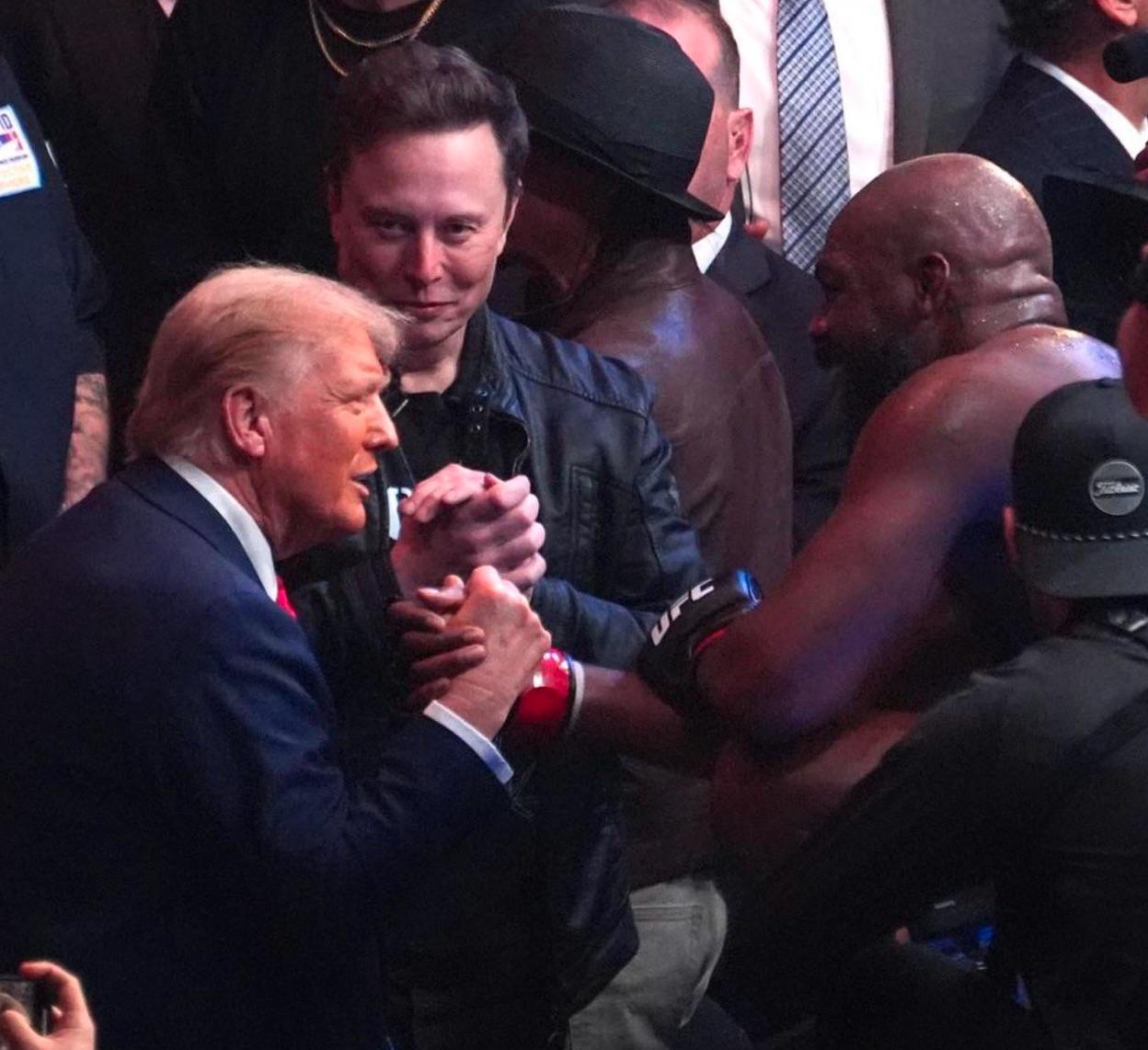 Elon Musk Giving Himself a Handshake While Trump and Jon Jones Share a Moment