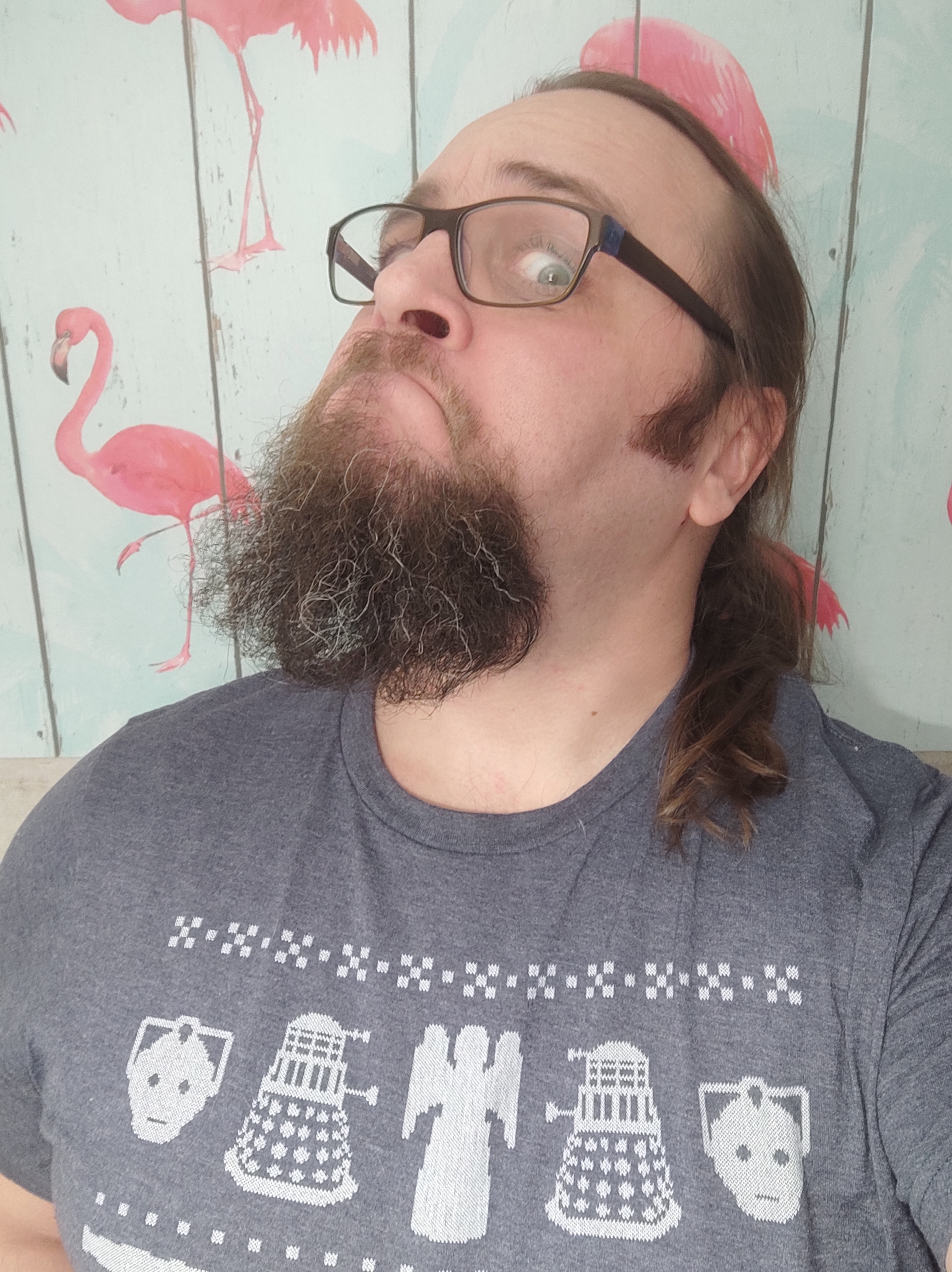 Christmas vibes: flamingos, a weird selfie stare, and all the checks!