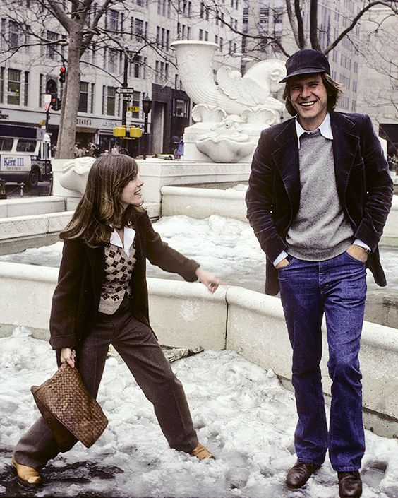 Two strangers enjoying a snowy day, captured in 1980