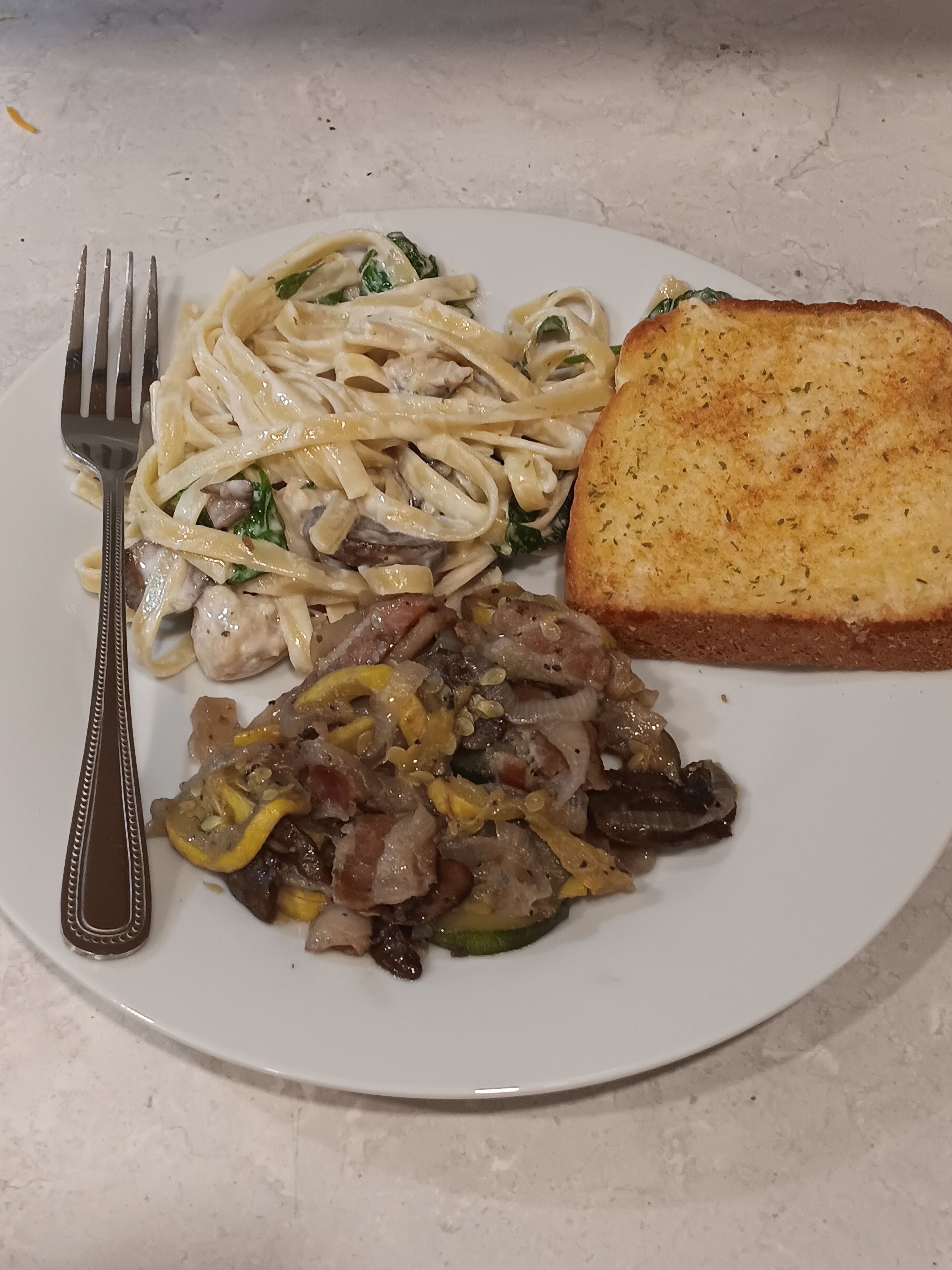 Indulge in a Feast: Chicken Alfredo, Garlic Parmesan Toast, and Sautéed Medley!