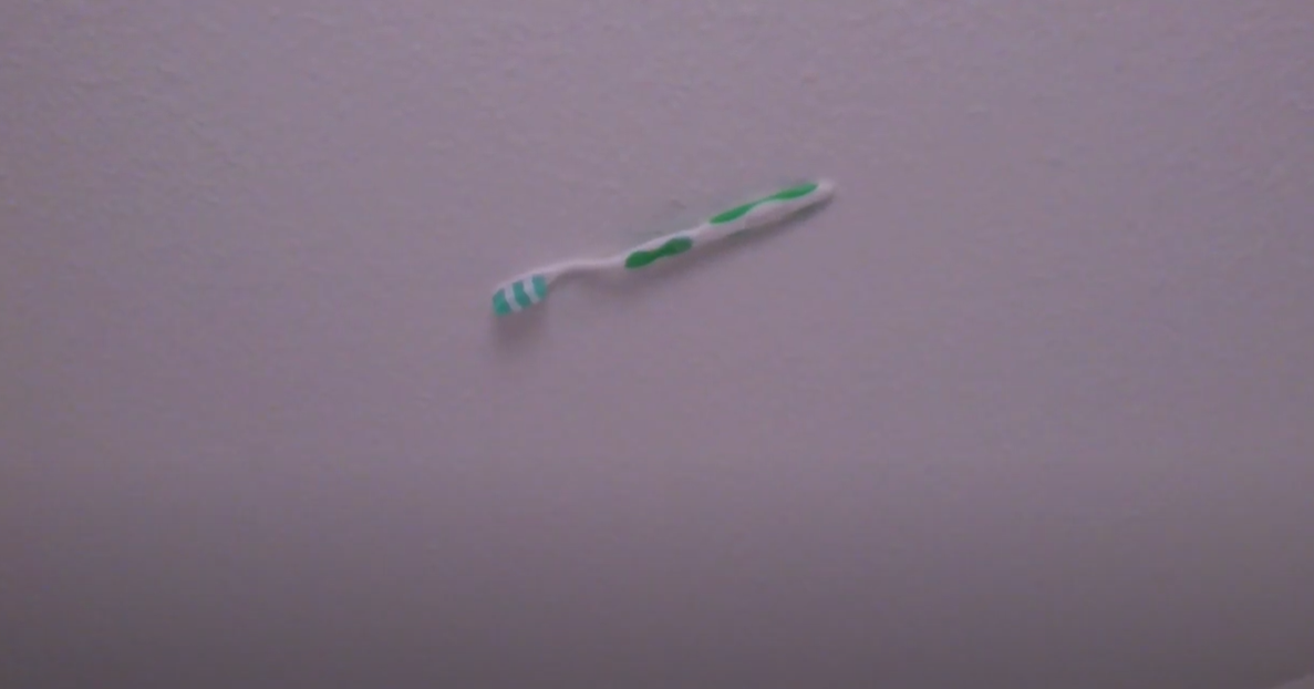 Toothbrush Suspended in Midair: A Quirky Ceiling Art