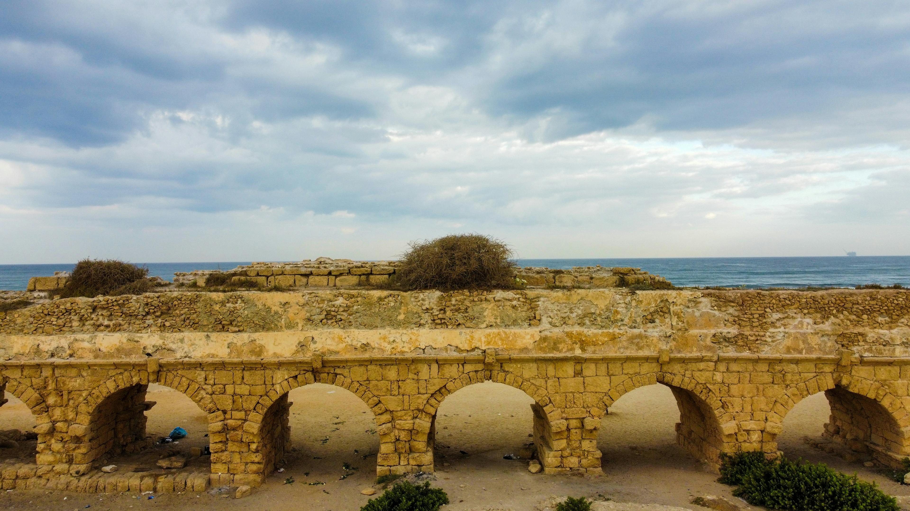 Caesarea's Ancient Aqueduct: A Majestic View Against the Sky