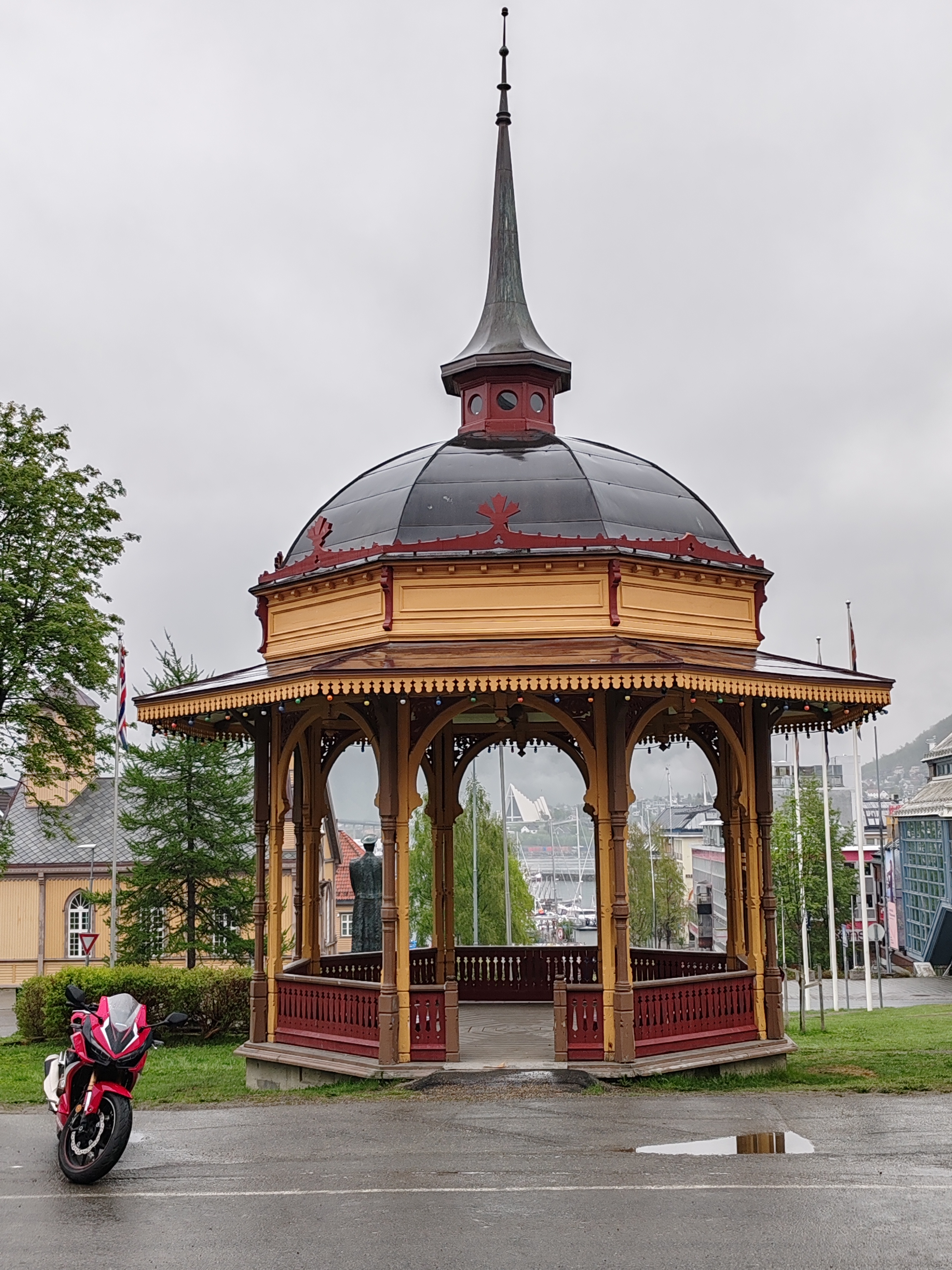 Exploring Tromso, Norway: A Red Bike by the Bandstand