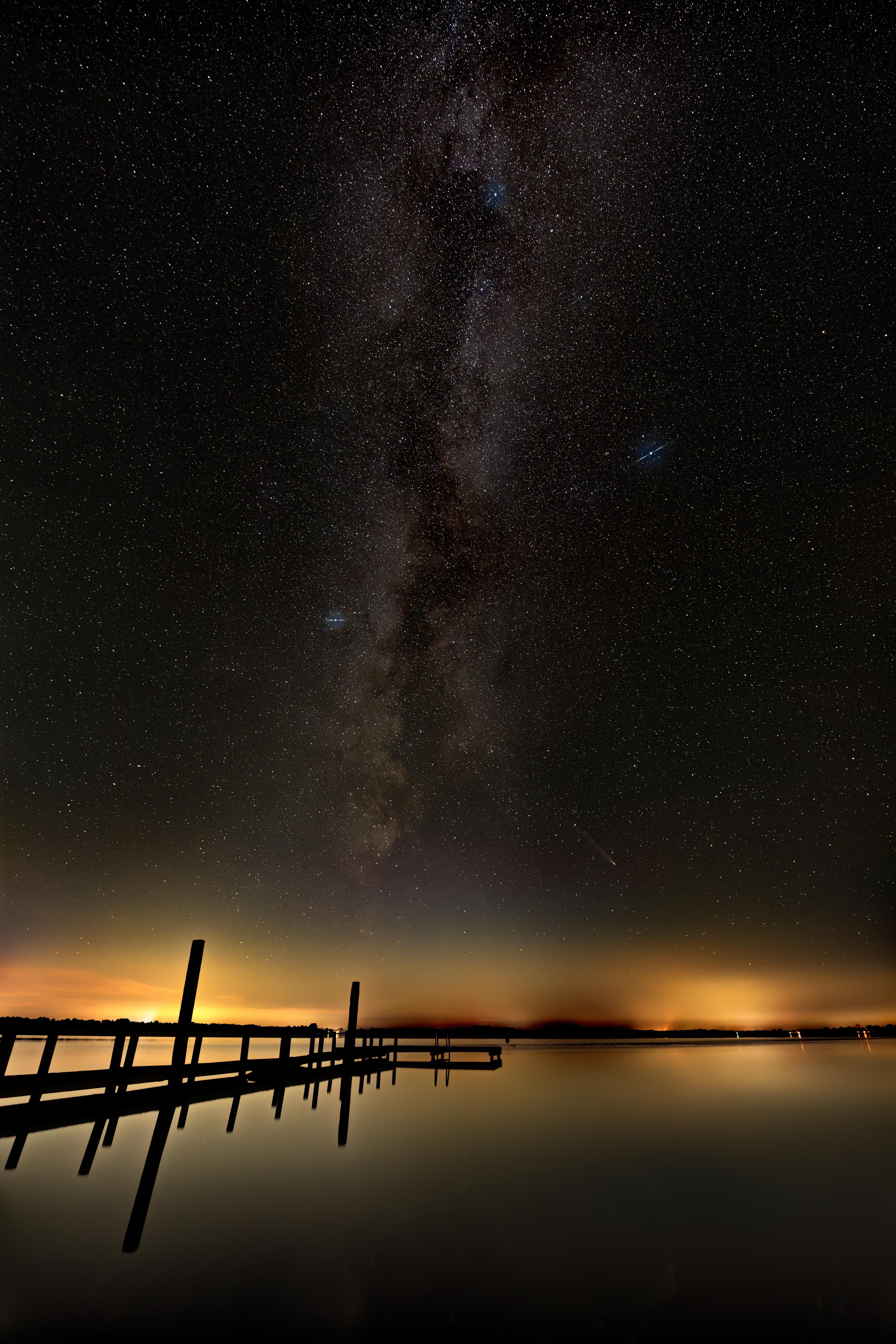 A Stunning Comet Over the Lake Beneath the Milky Way