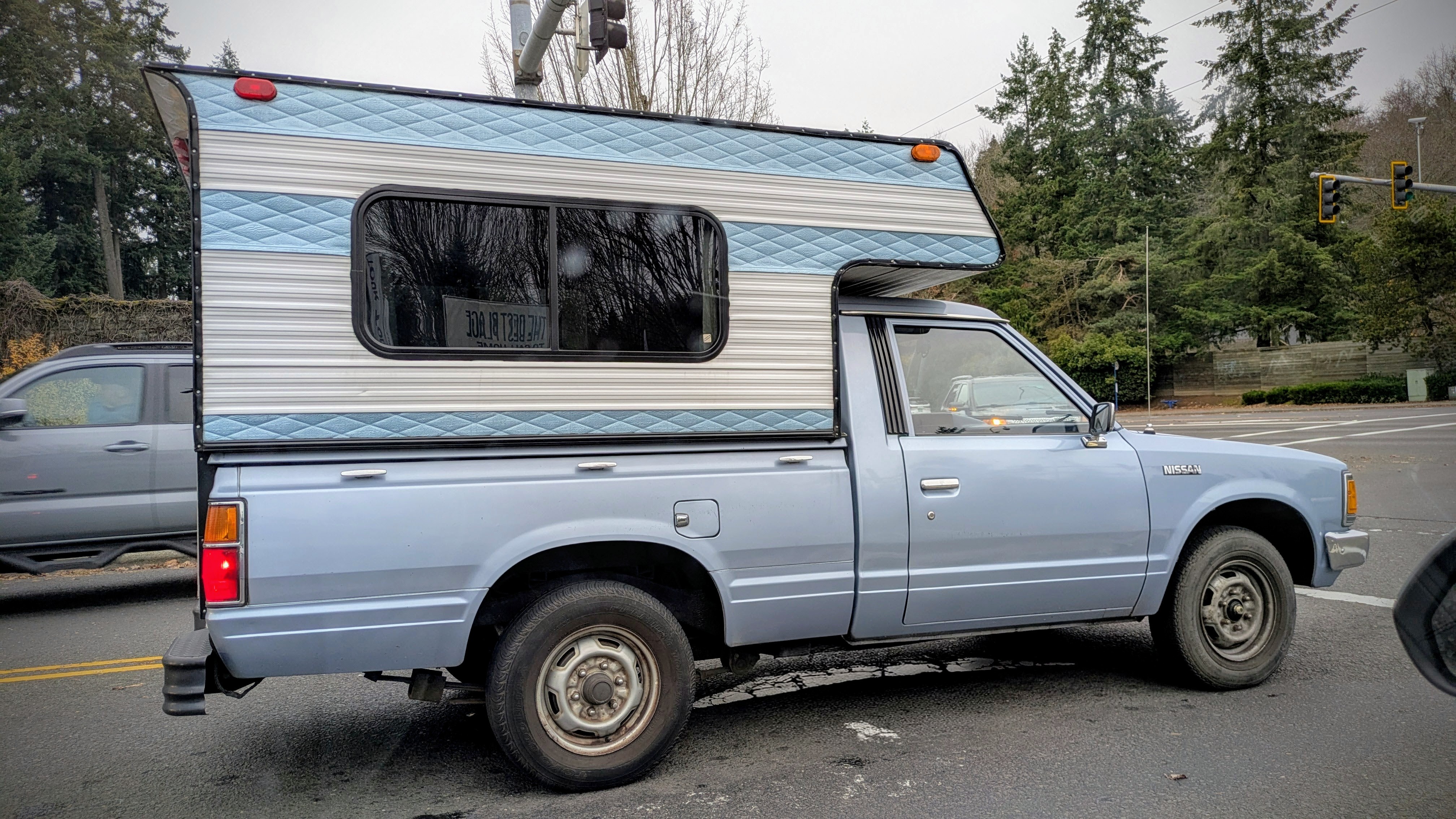 Check out this cool vintage mini pickup with its matching camper top!