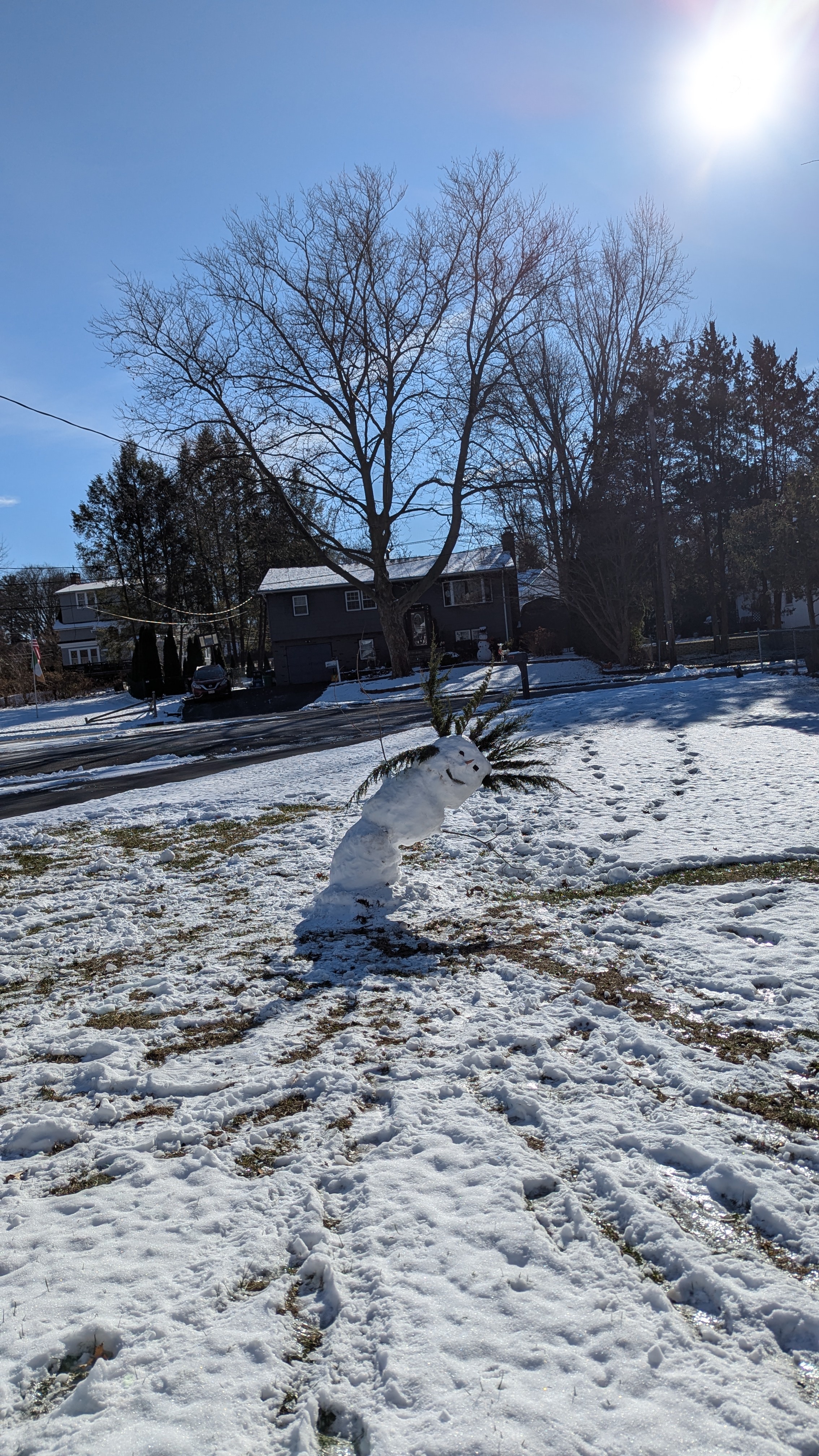 A snowman really leaning into the chill