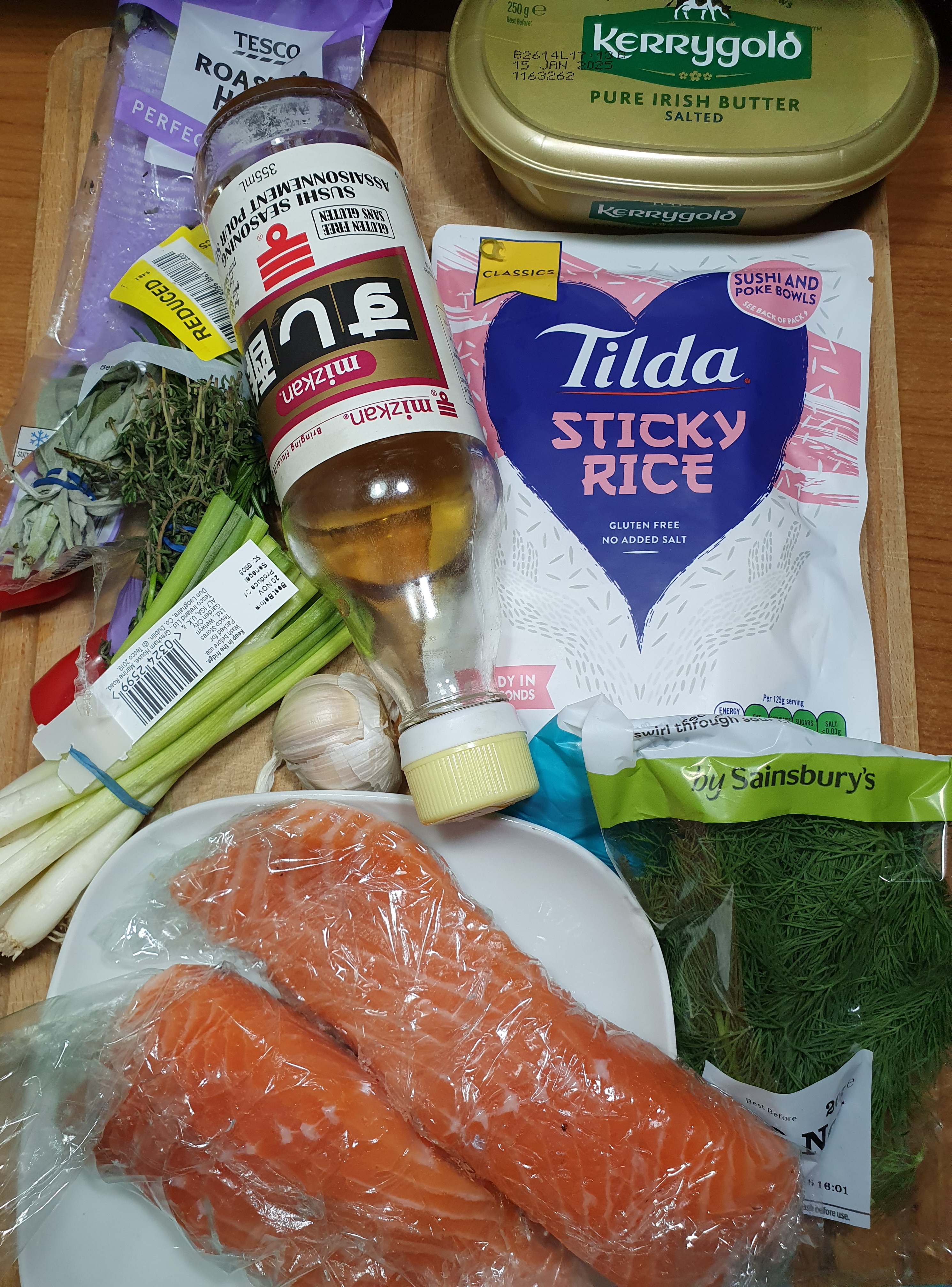 Pan-fried salmon fillets served with rice and a side of curiosity